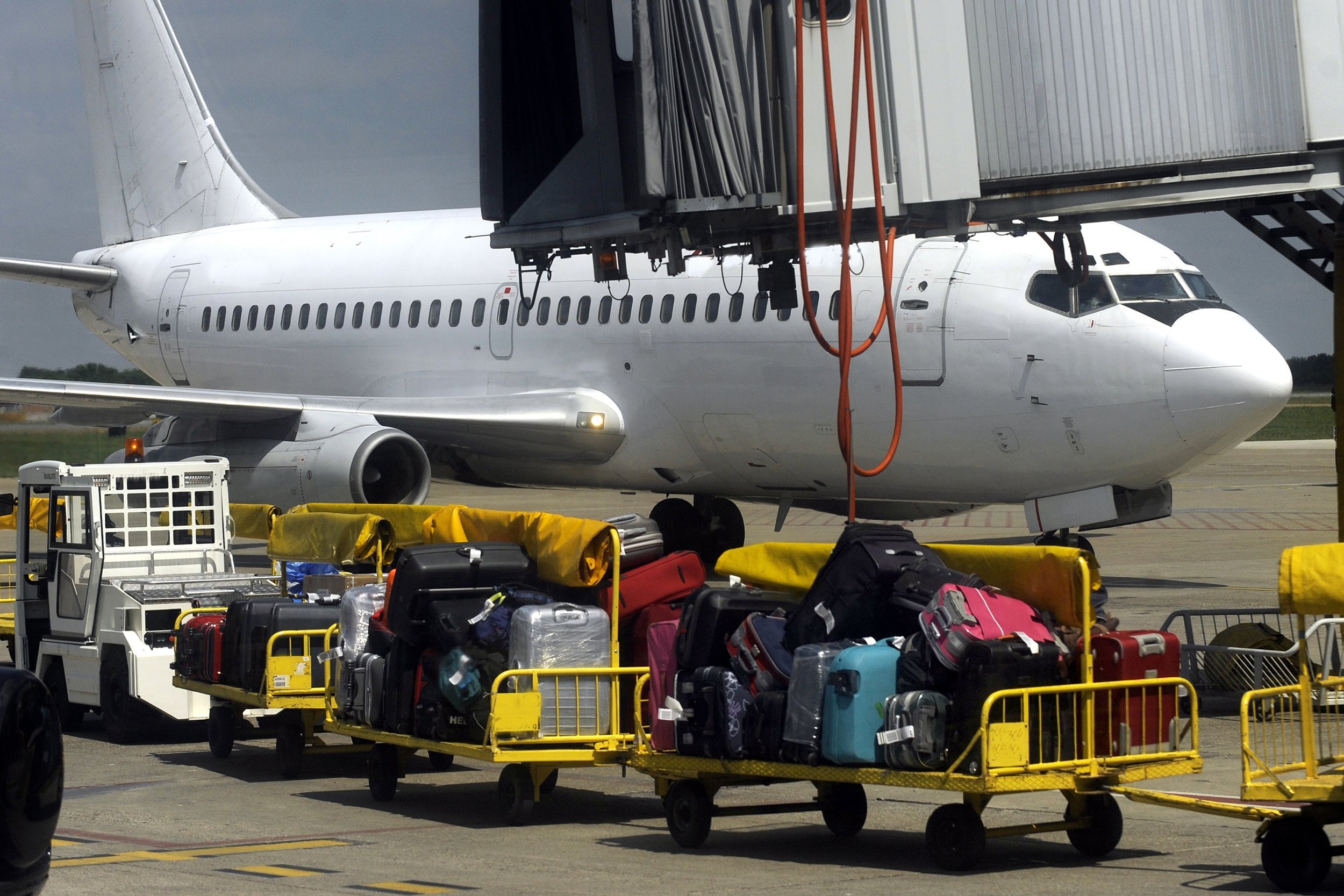 passengers luggage loading in to the plane