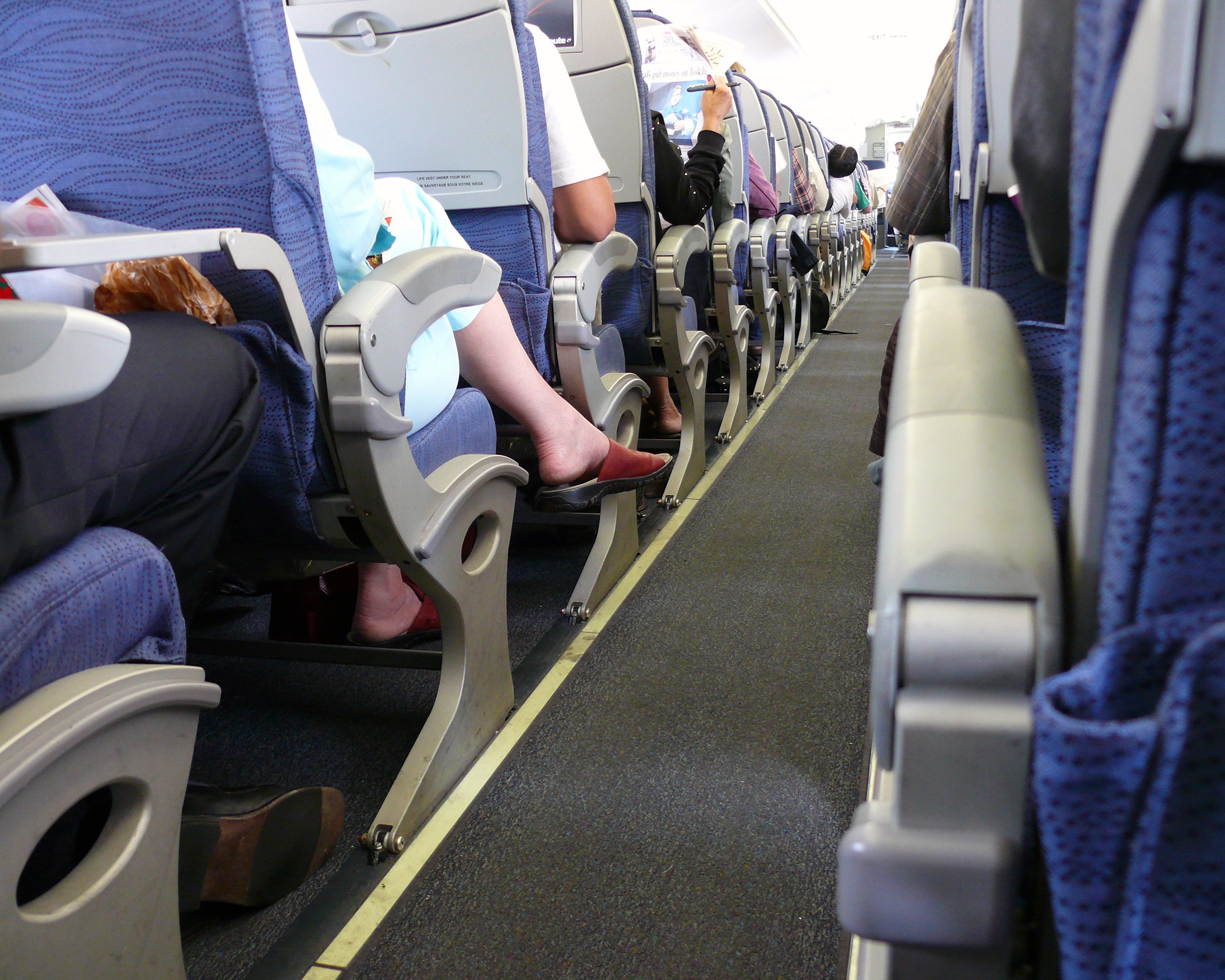 people in economy airplane seats