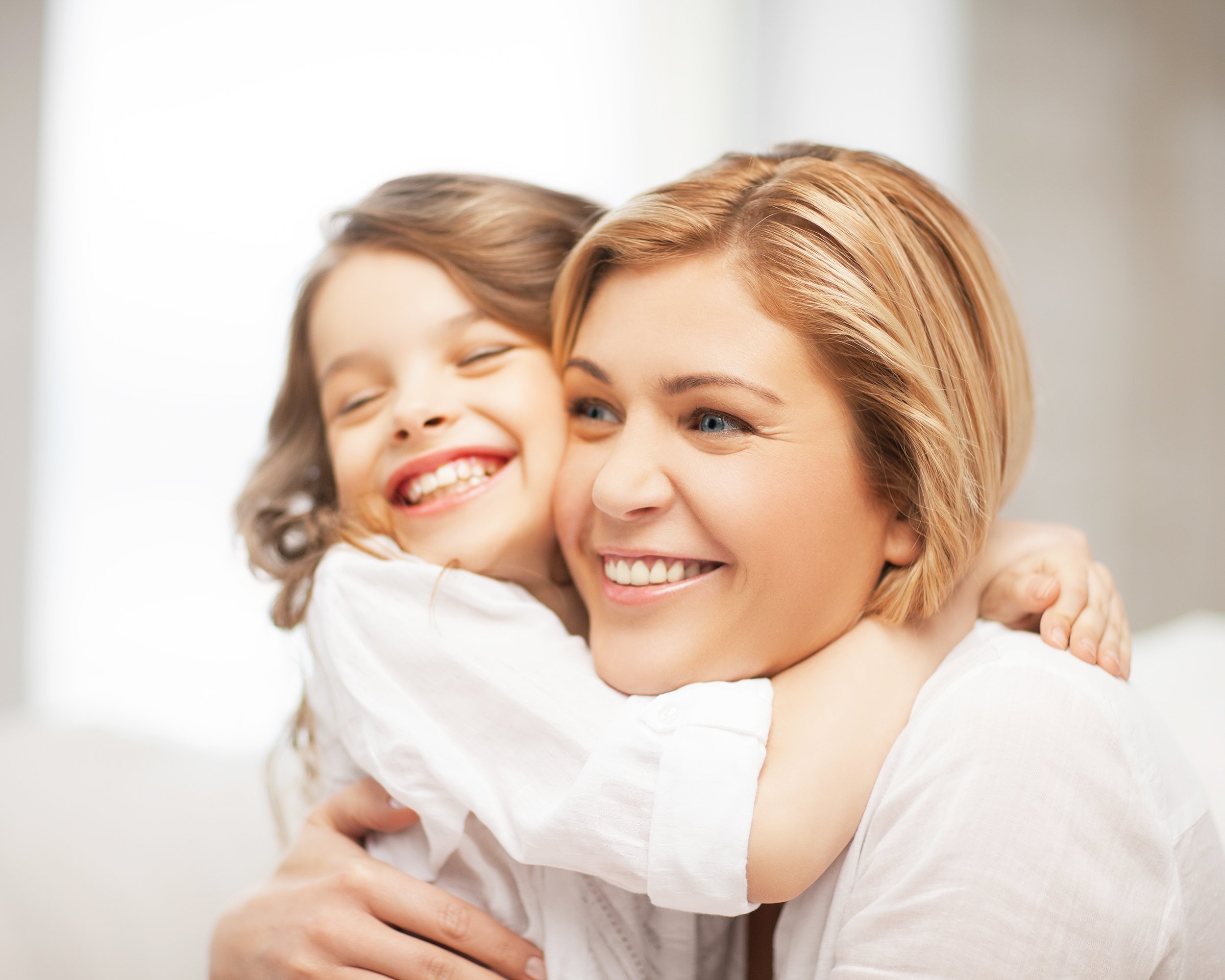 hugging mother and daughter