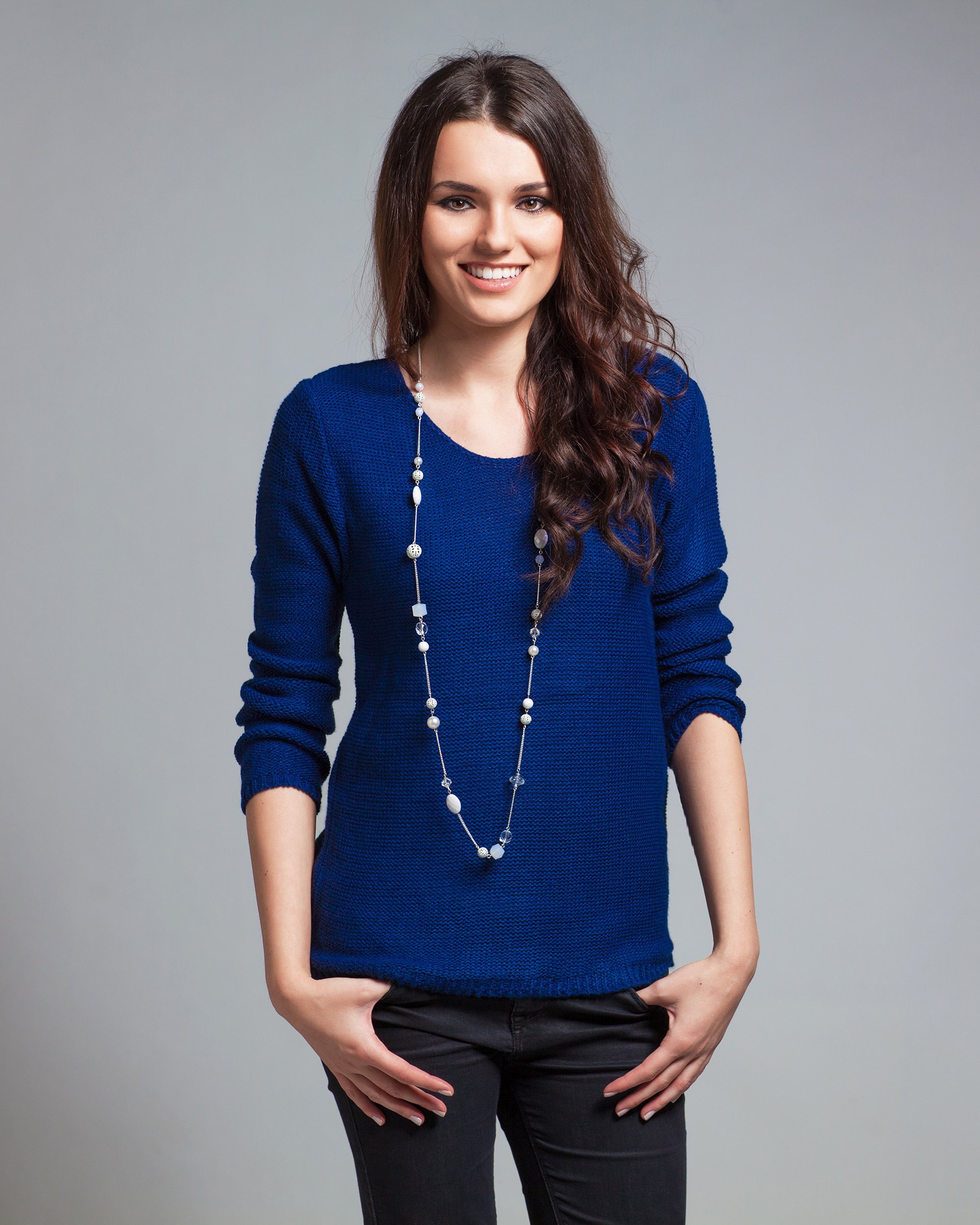 happy woman wearing blue blouse