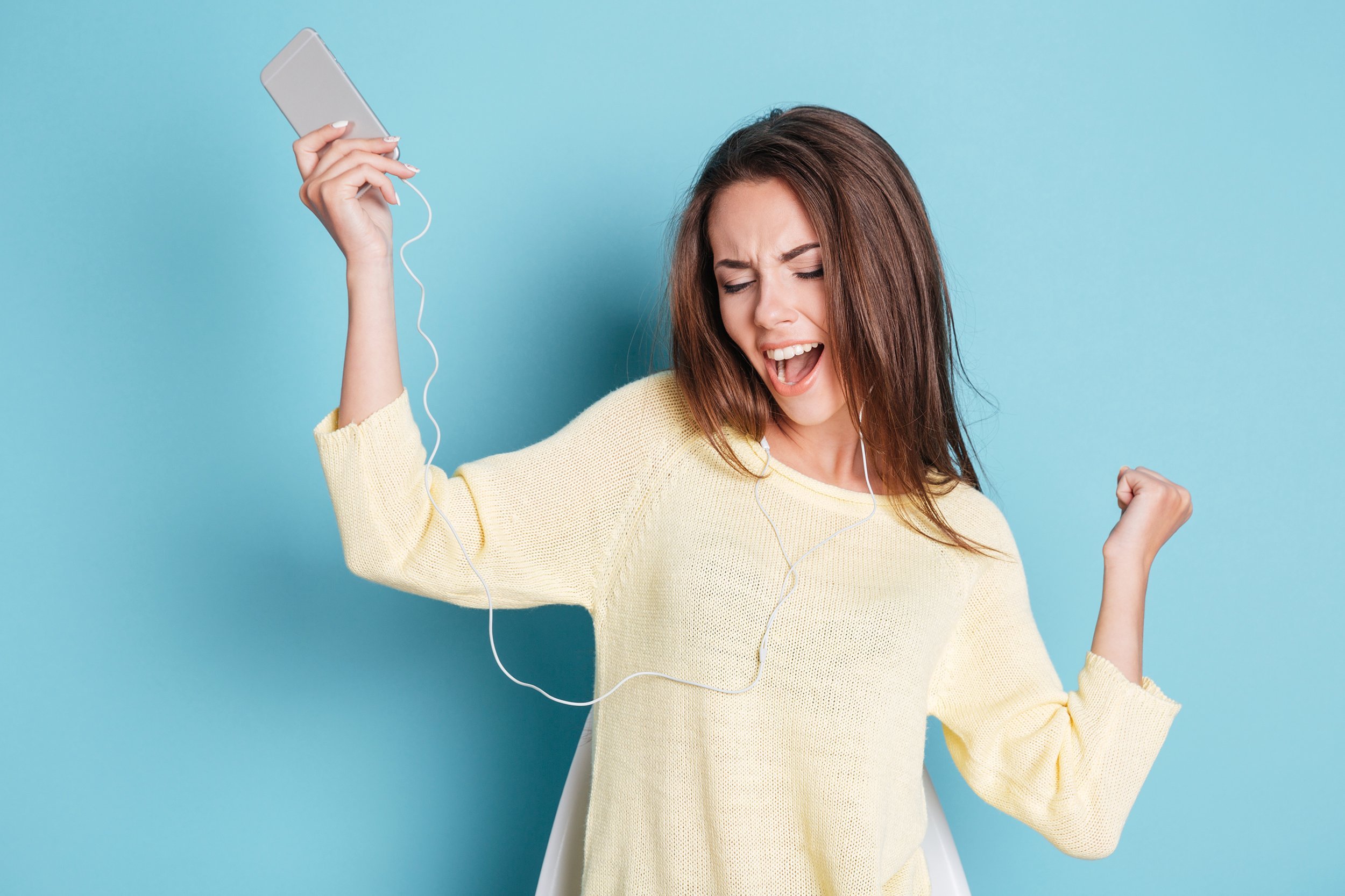 woman with headphones dancing