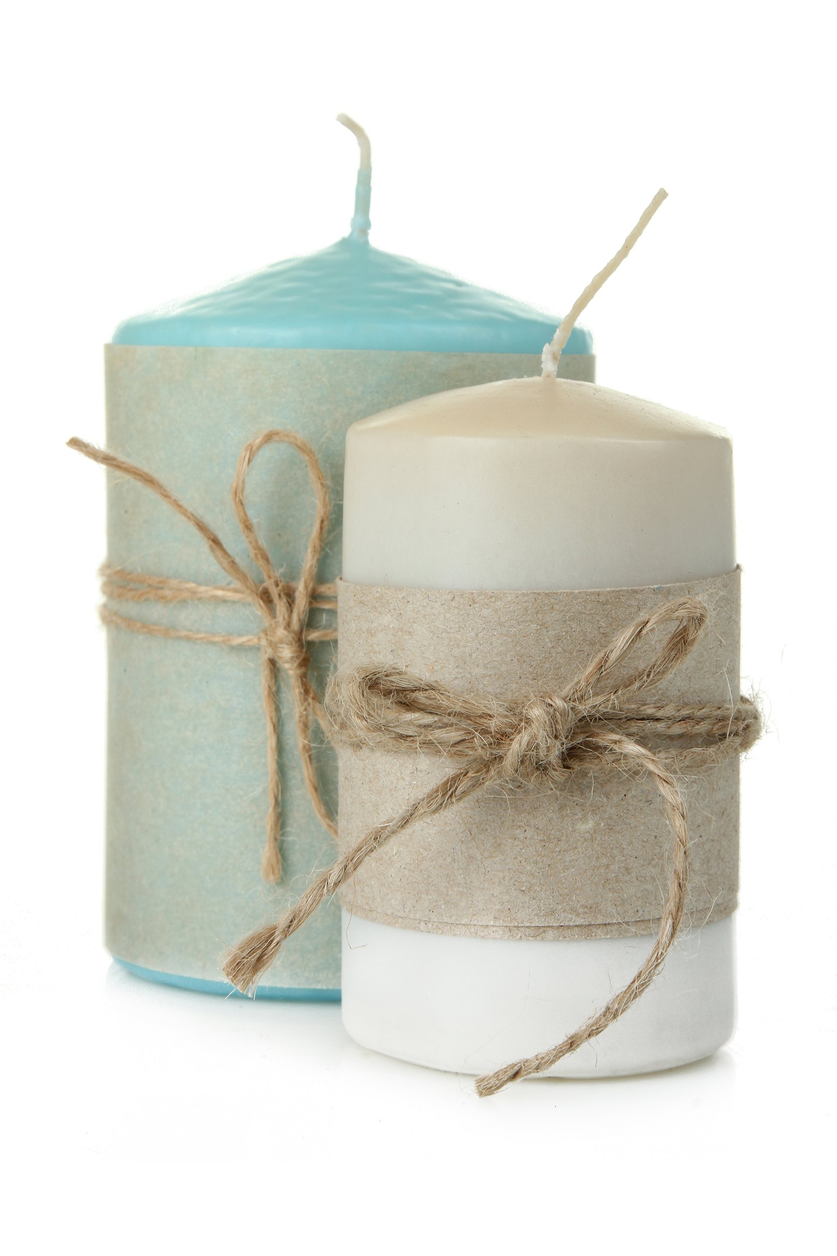 A blue and white decorative candle wrapped in burlap and twine