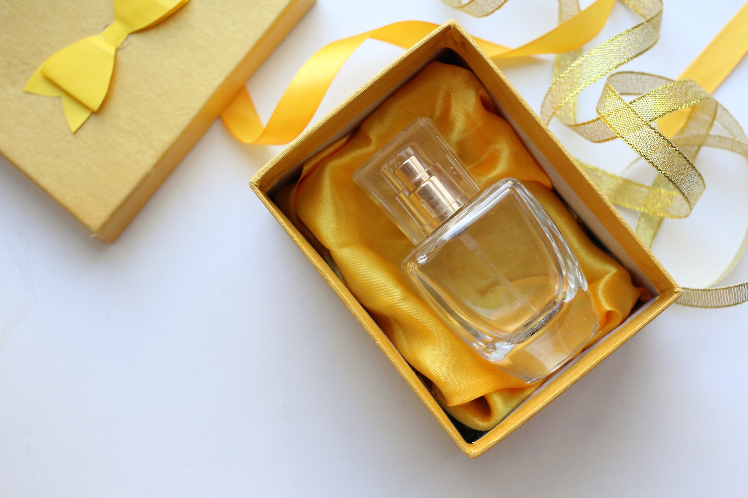 Perfume in a gold gift box