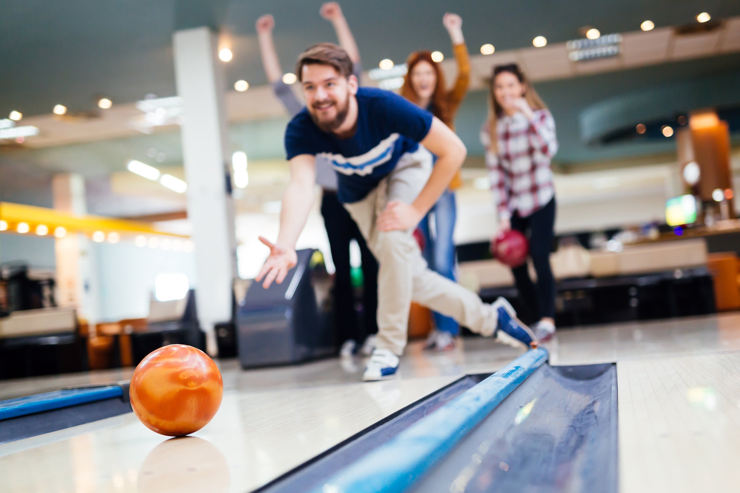 friends having fun while bowling