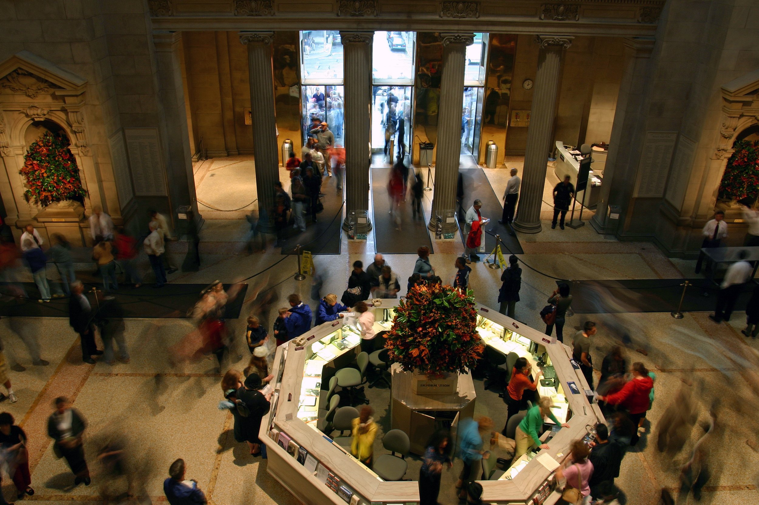crowd at the MET information desk