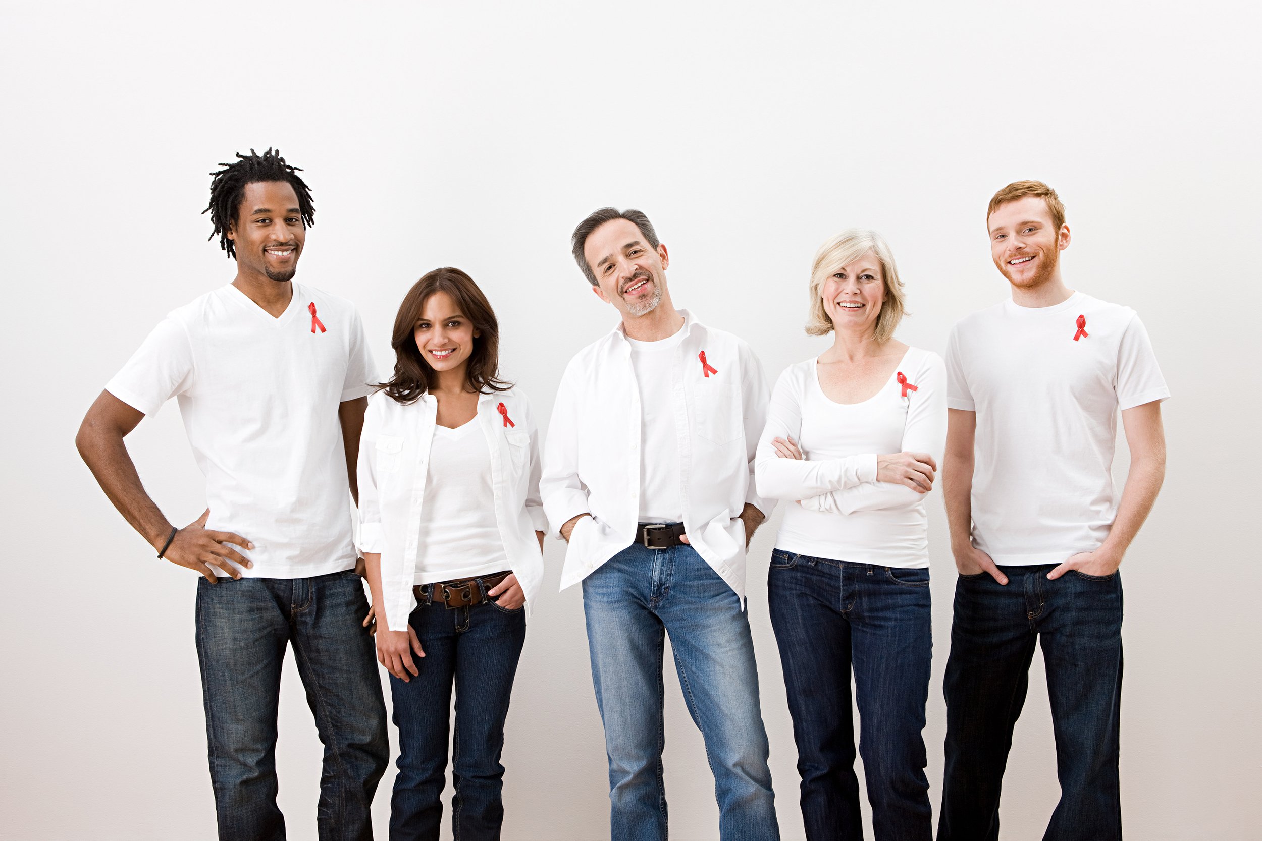 Group of people wearing white shirts and red ribbons for Aids Day