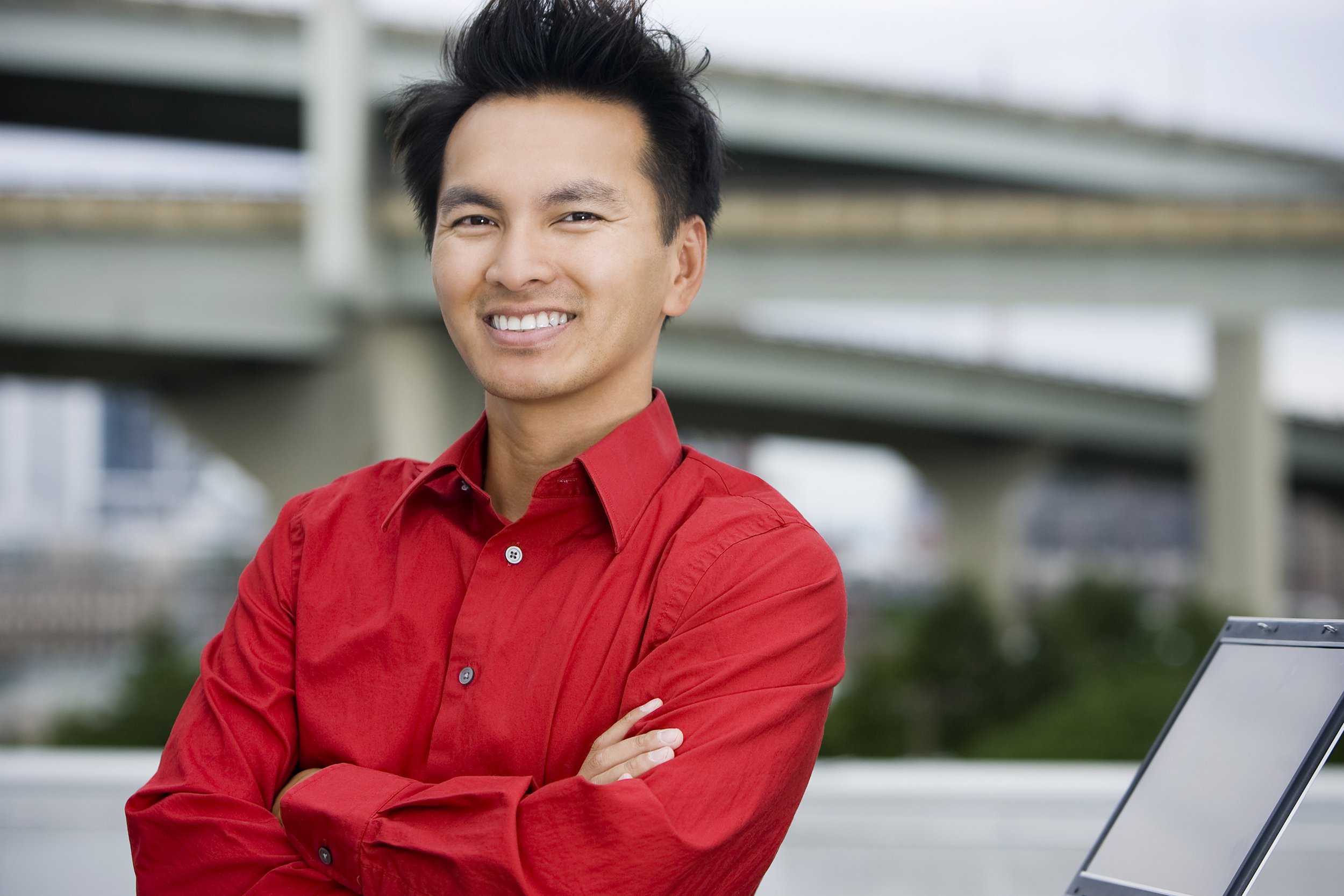 Asian businessman wearing a red-collard shirt