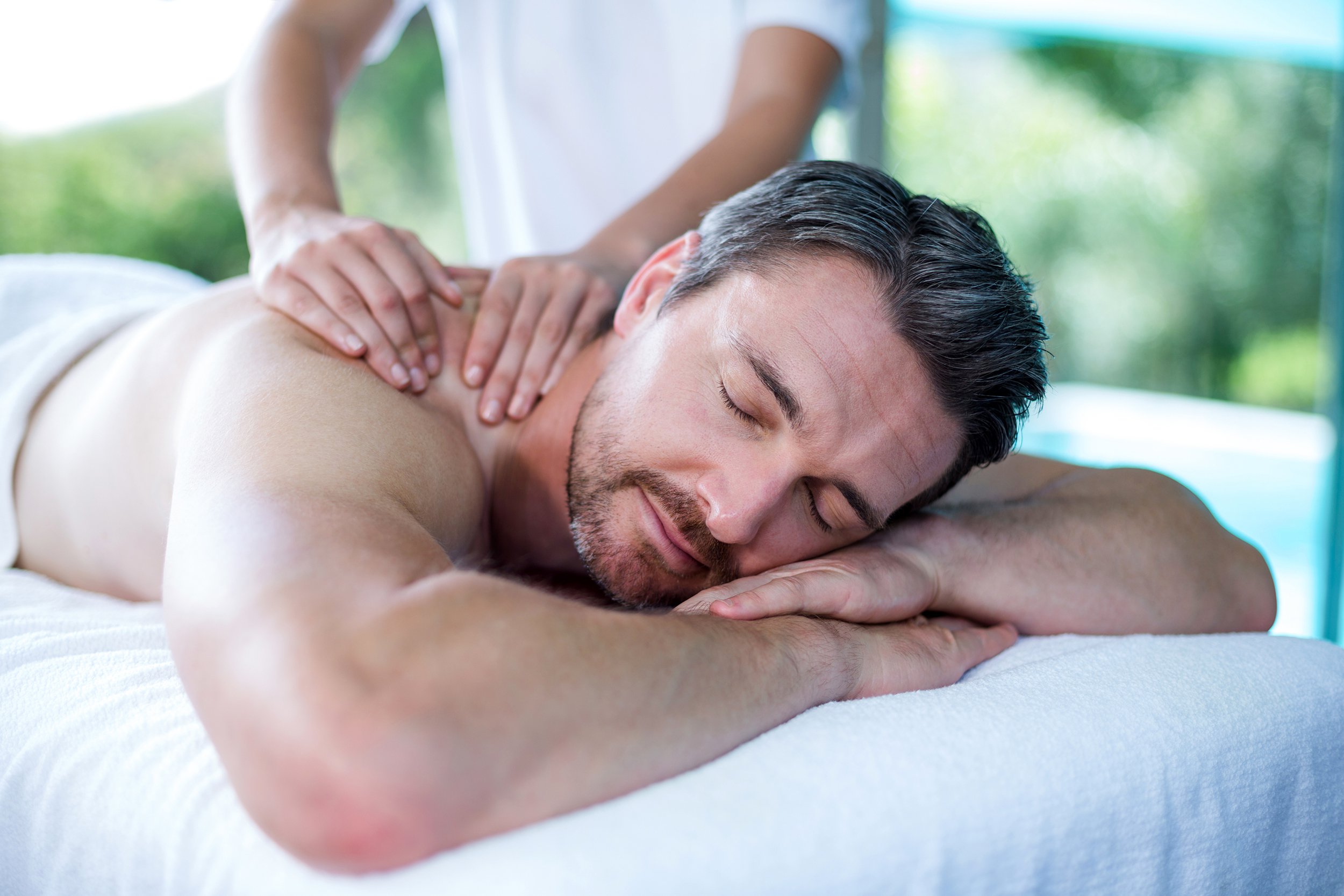 Middle-aged man getting a massage