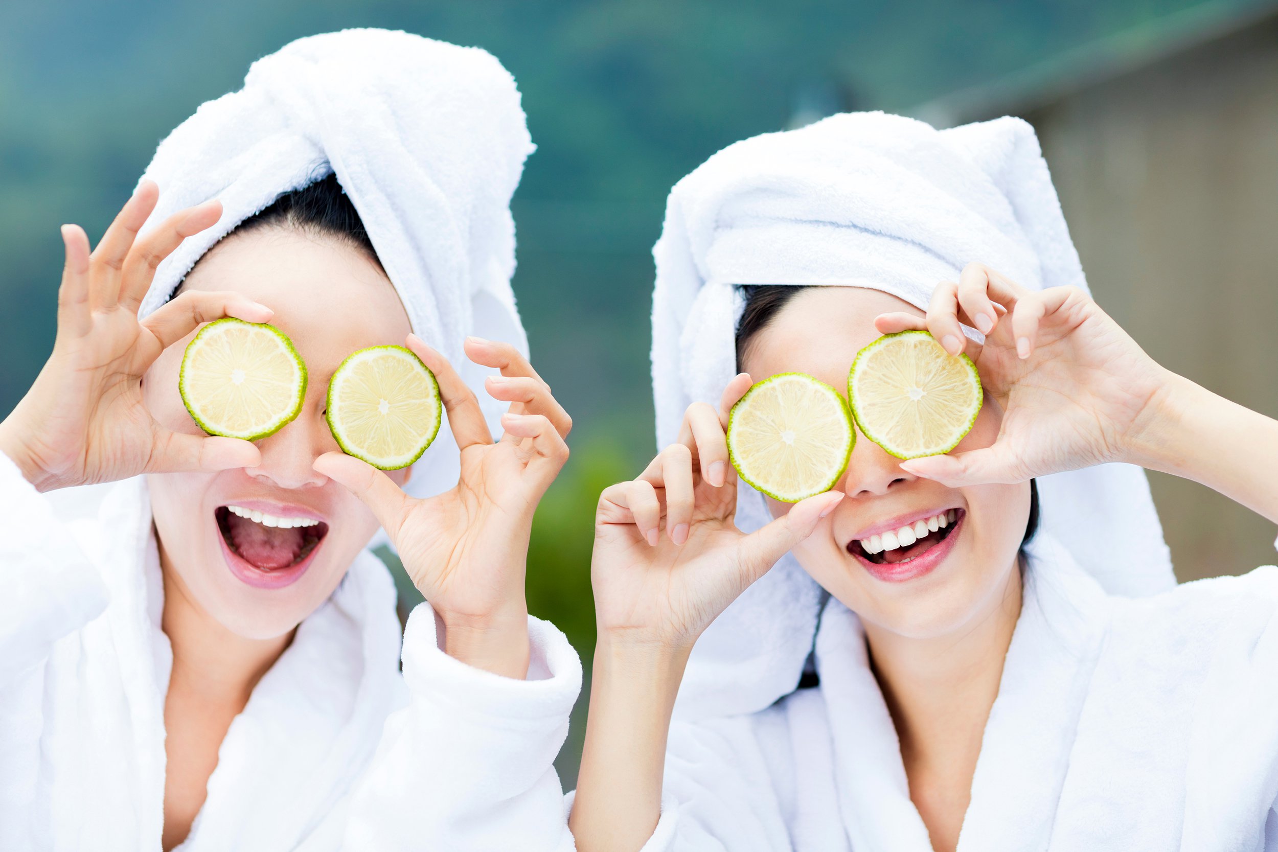 Two young women having fun on a spa day