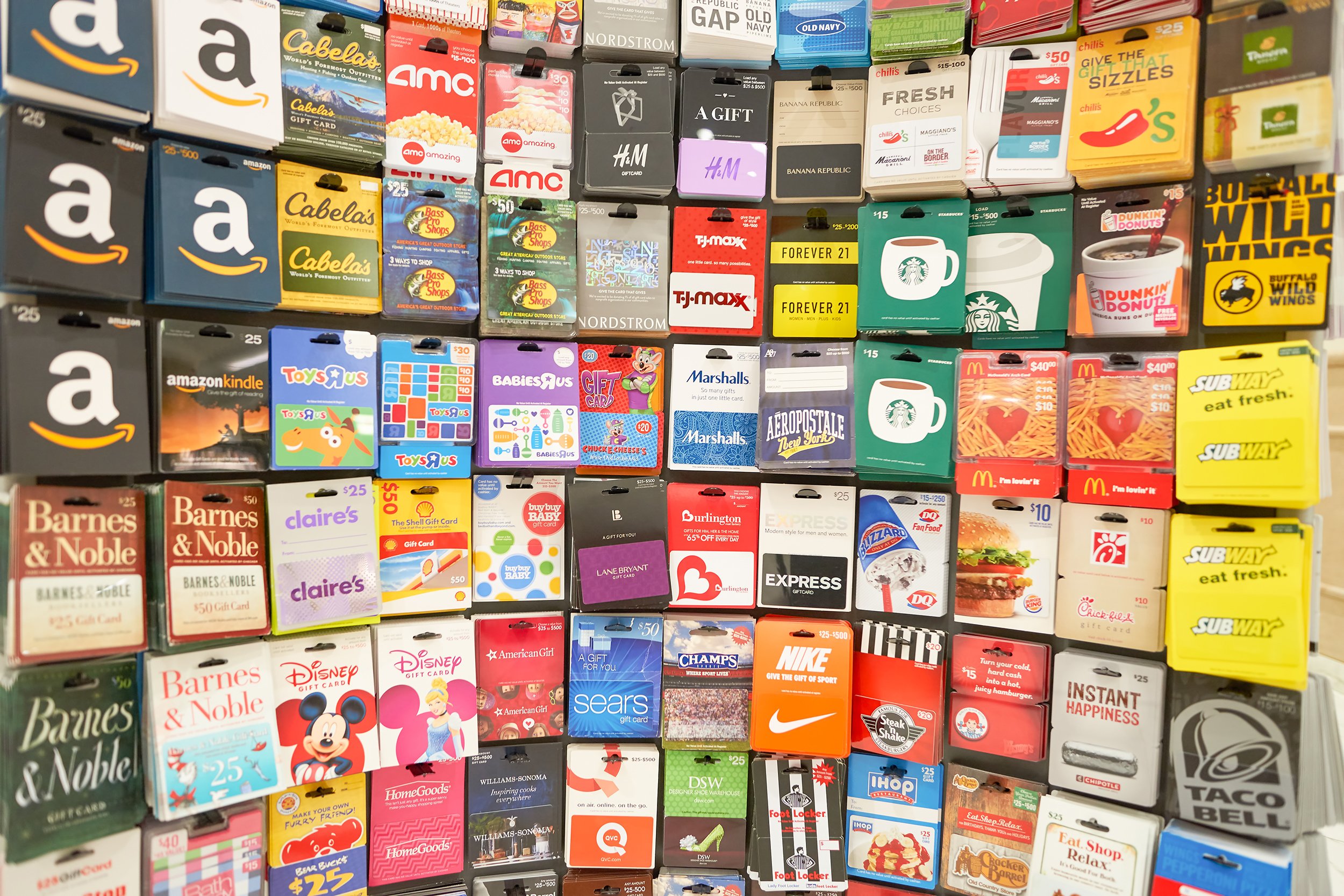 Wall display of gift cards in a grocery store
