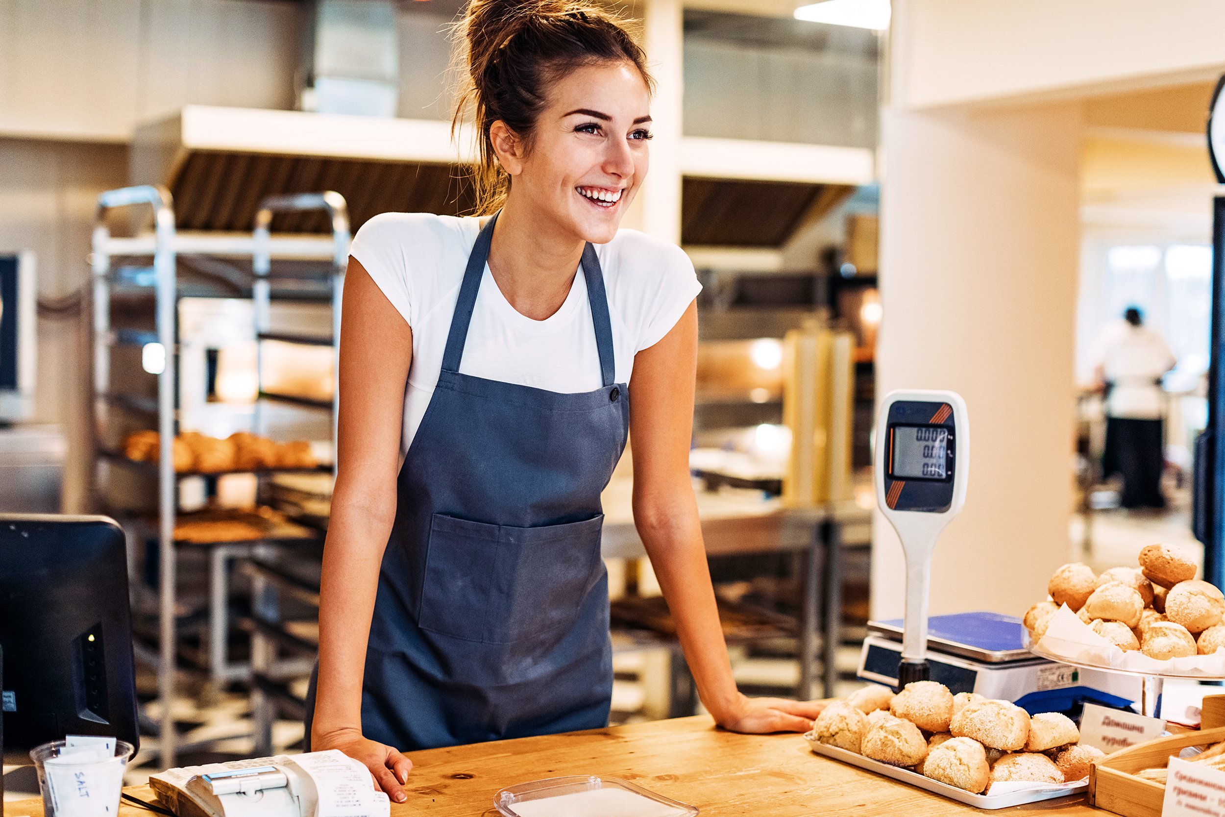 woman at check out counter in the bakery