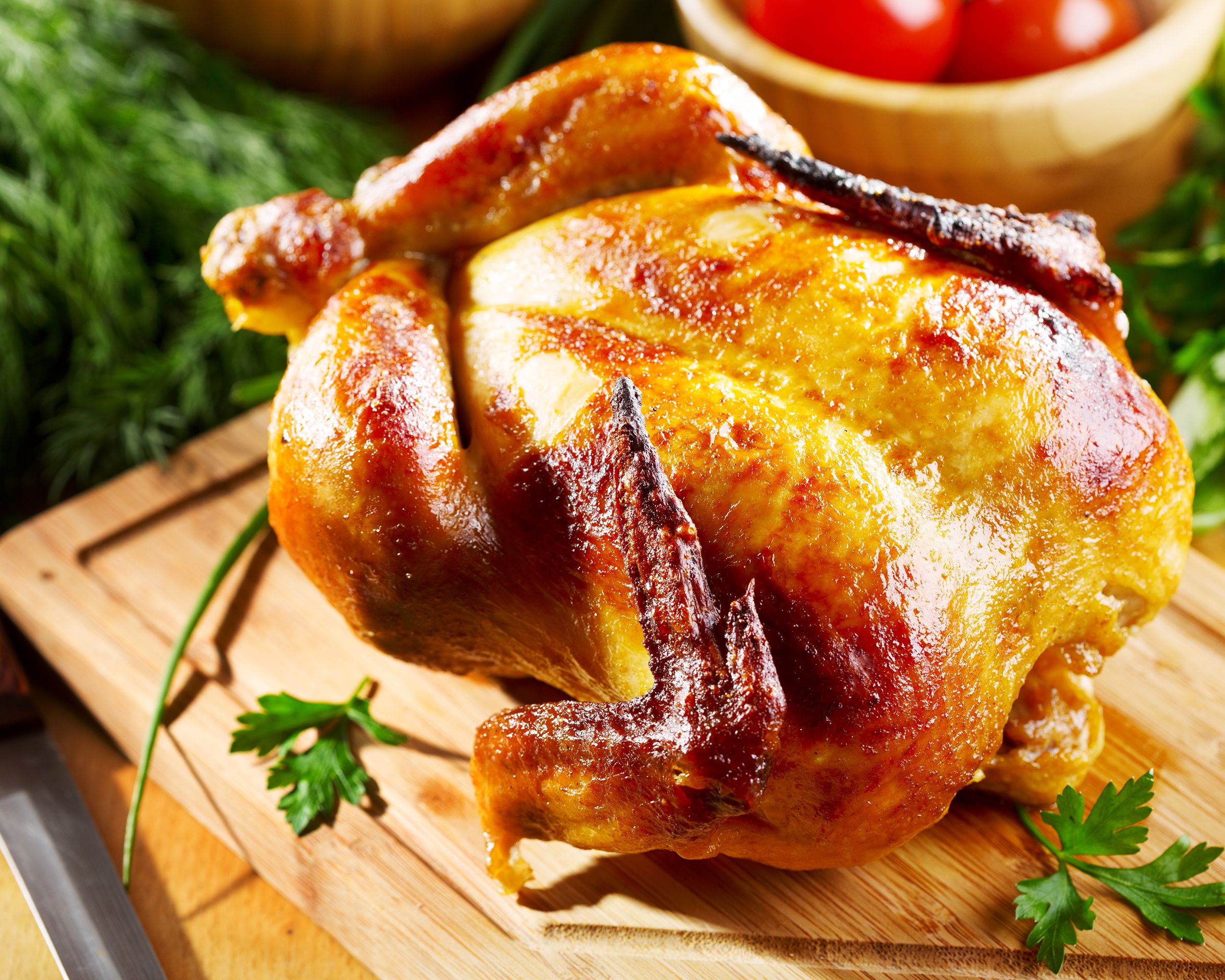 Whole Roast Chicken on a wood cutting board