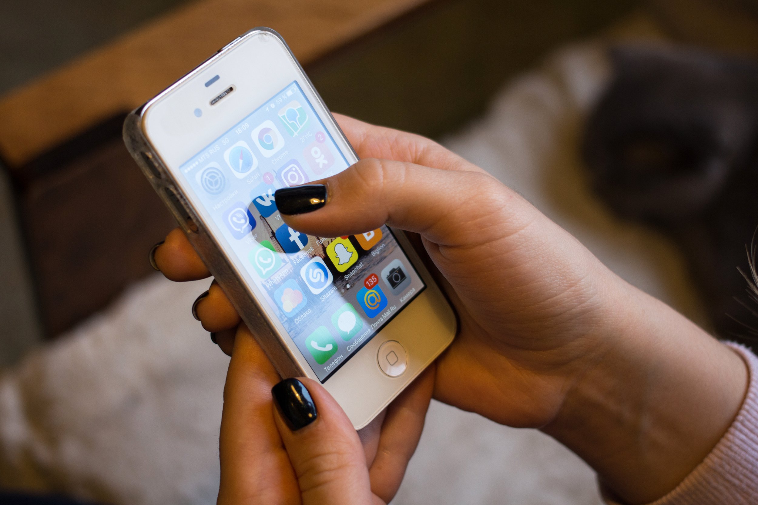 hands on phone with apps