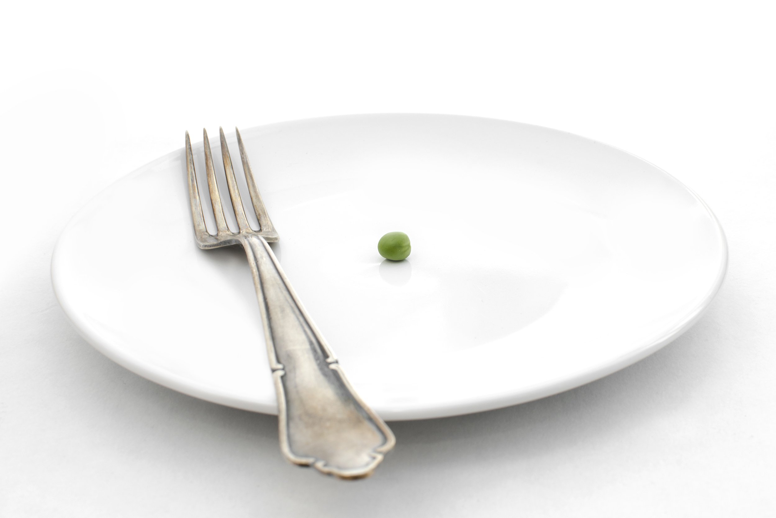 plate with fork and one pea