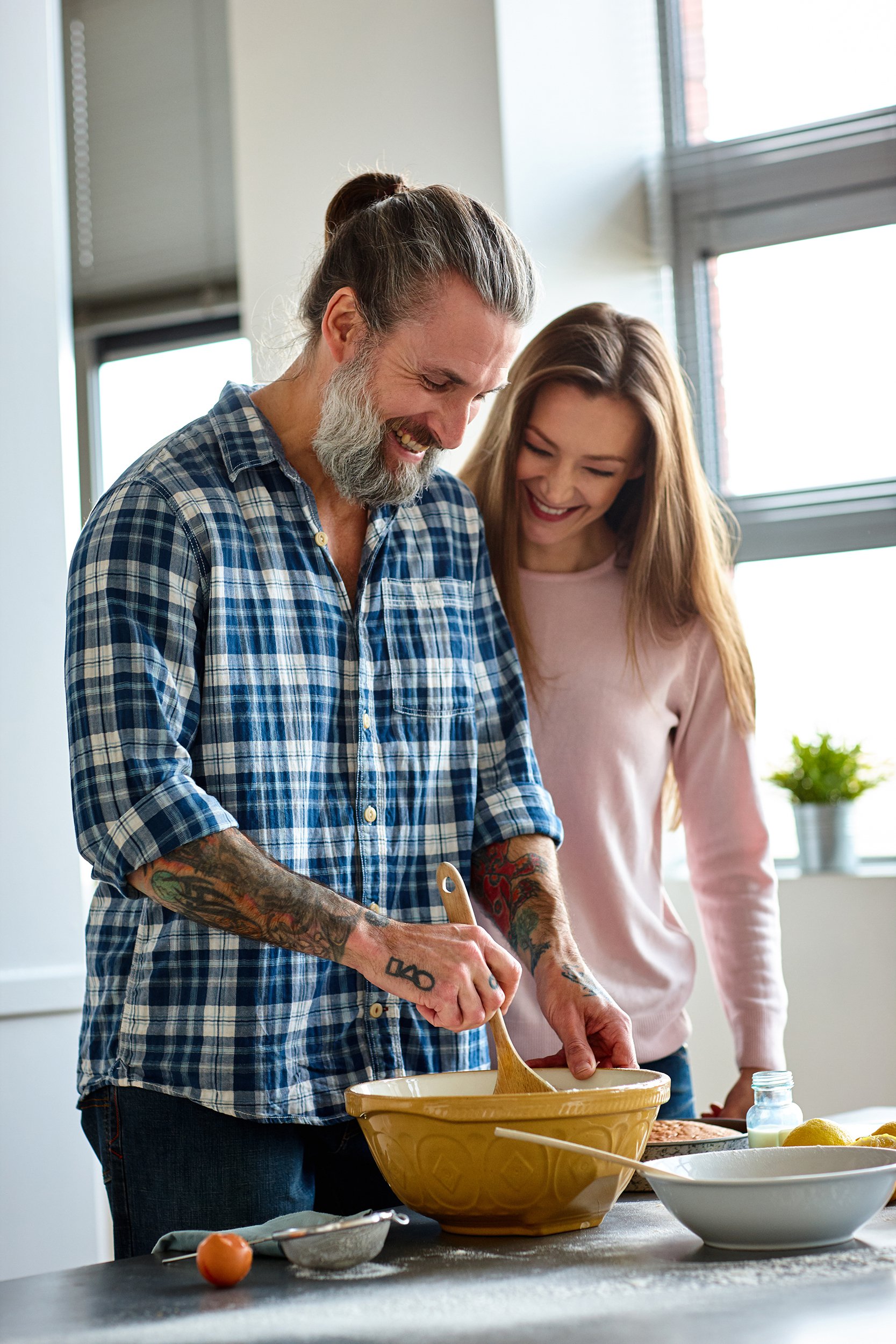 middle-aged couple making a pie