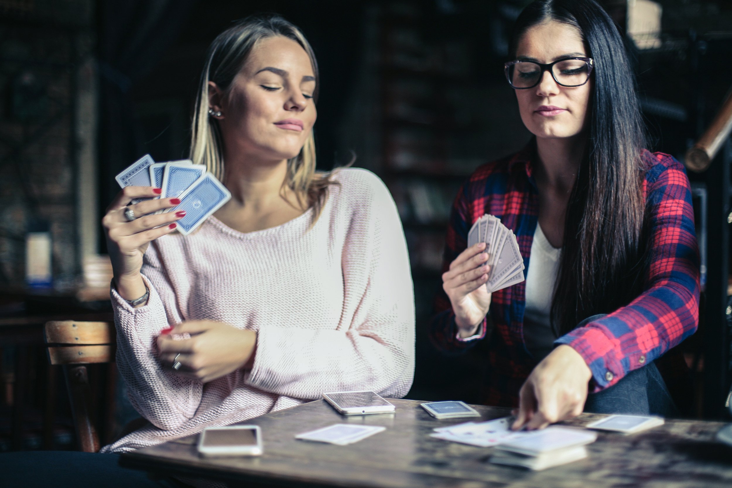 young women playing poker