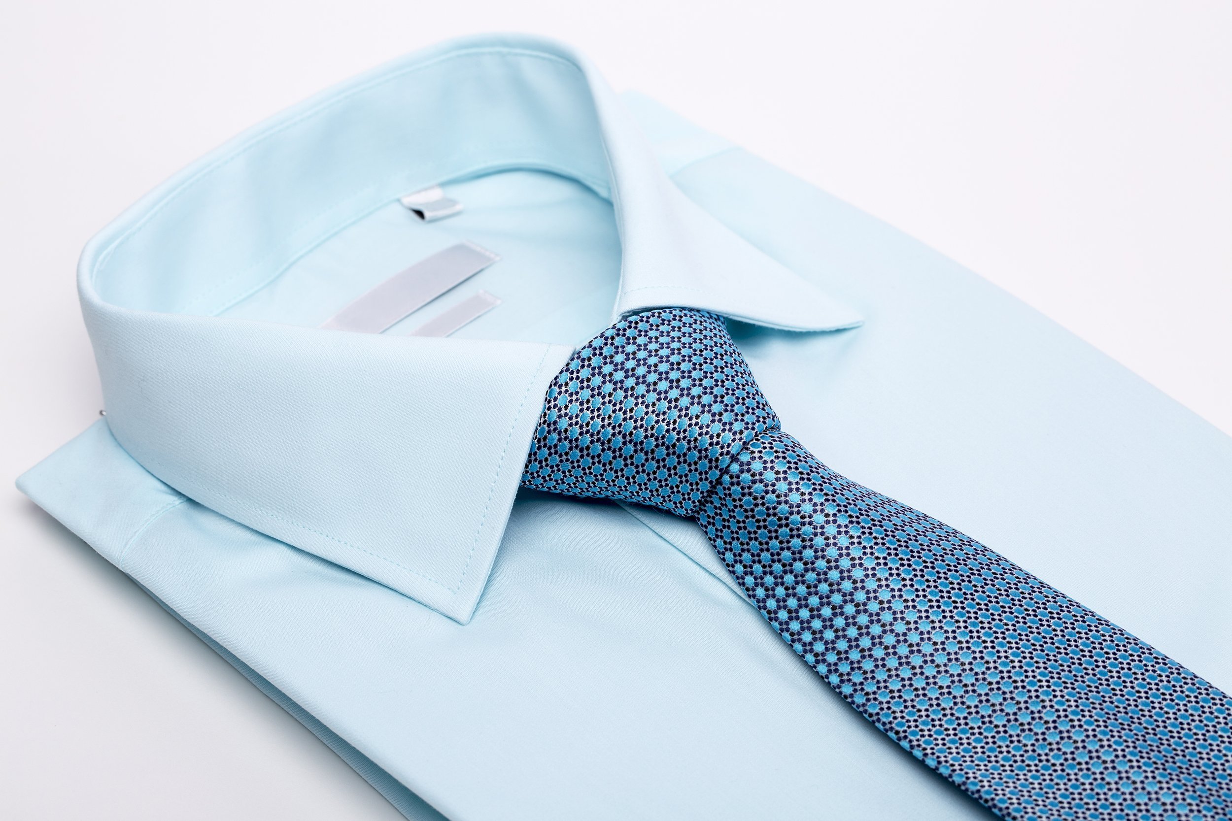 men's blue dress shirt and tie