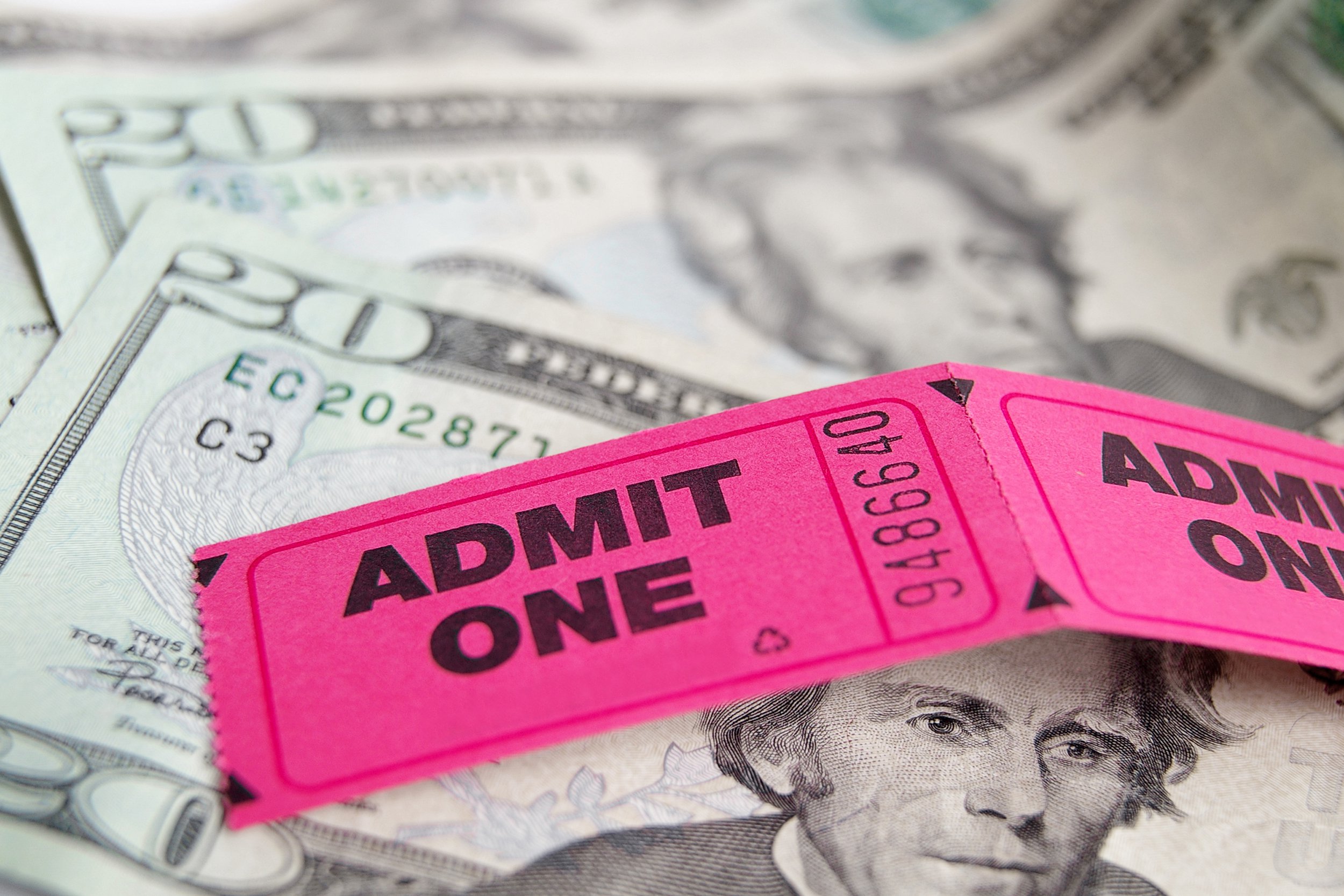 Movie tickets on top of money