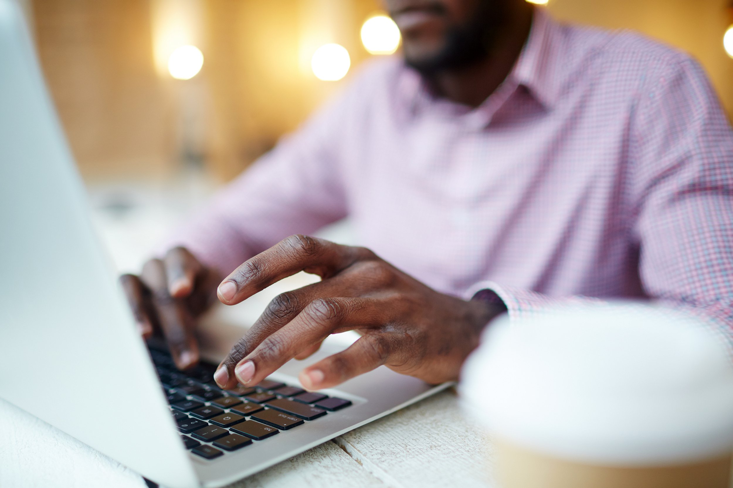 Man typing on a laptop
