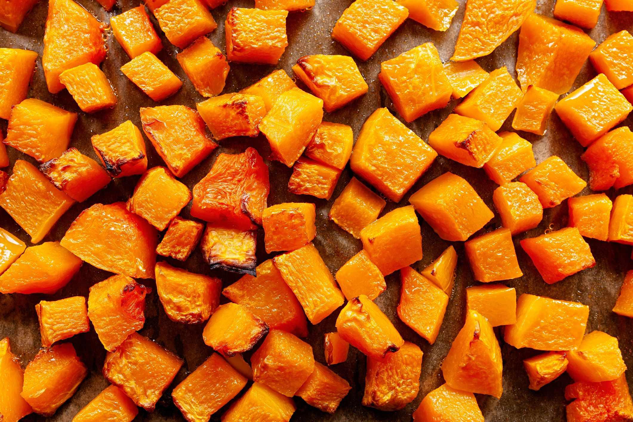 Top view of roasted butternut squash cut in small pieces