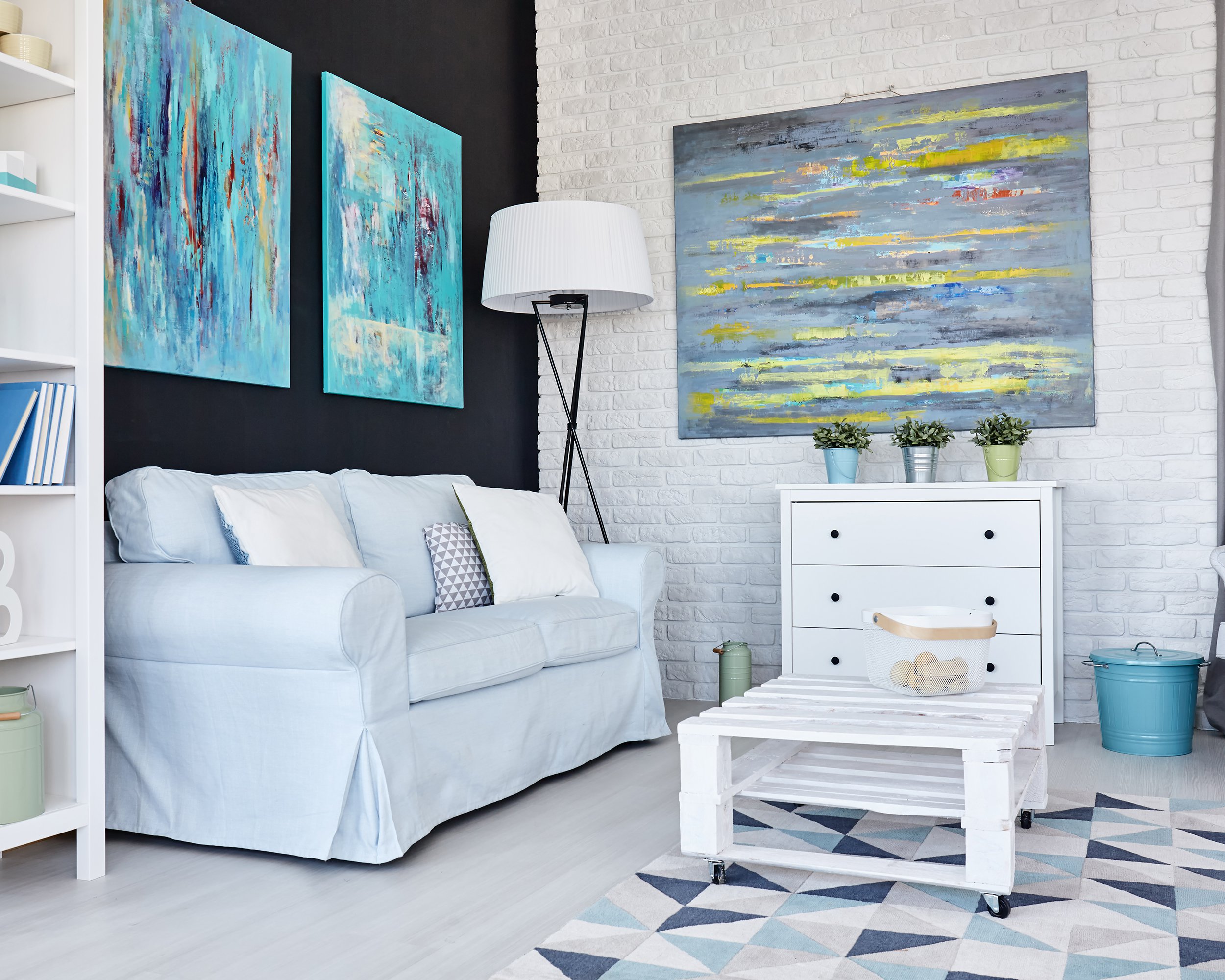 living room with paintings on wall