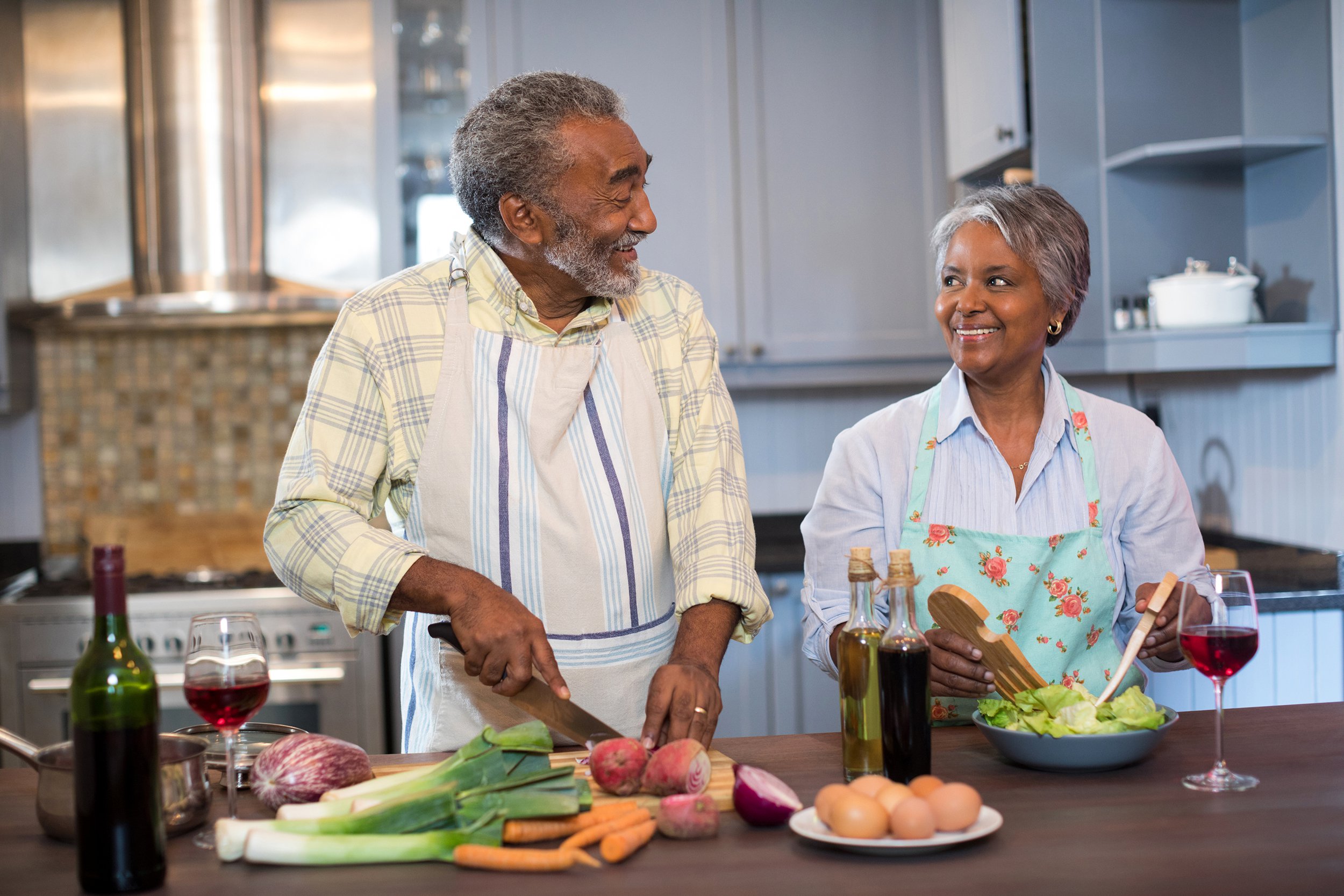 Senior couple cooking a healthy dinner