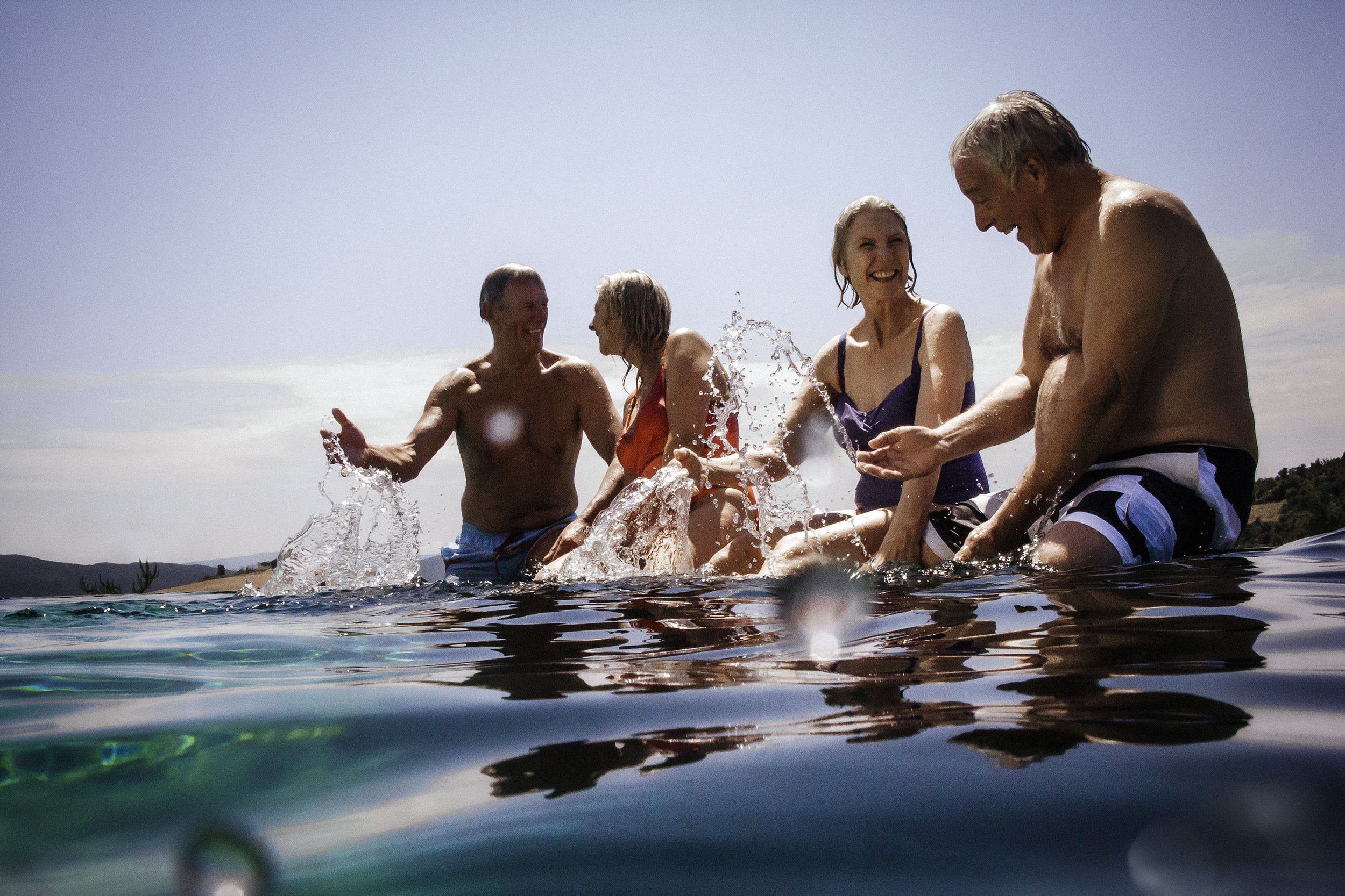 Group of senior friends in a pool or ocean