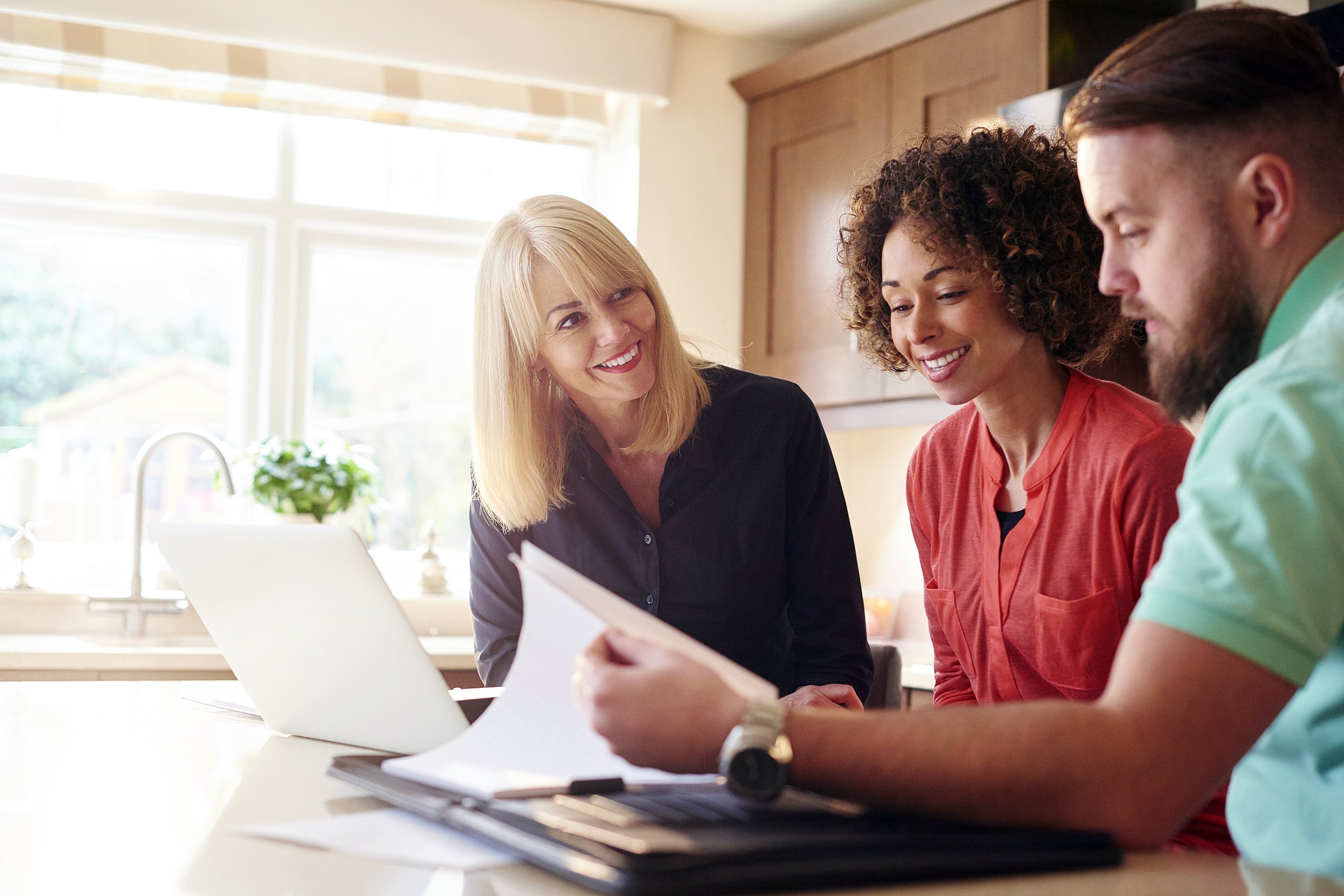 Couple talking with real estate agent