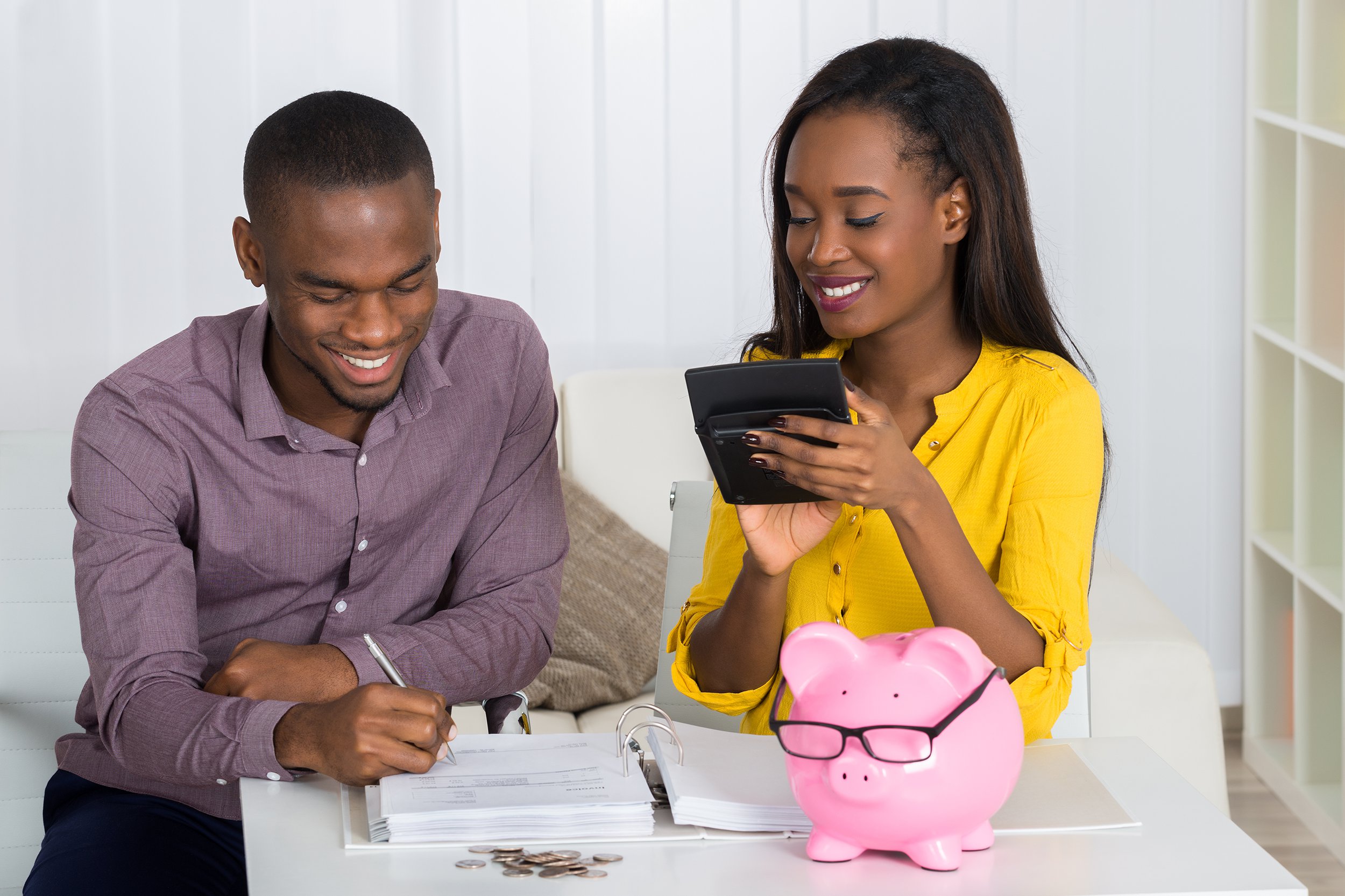 Couple making a budget at home