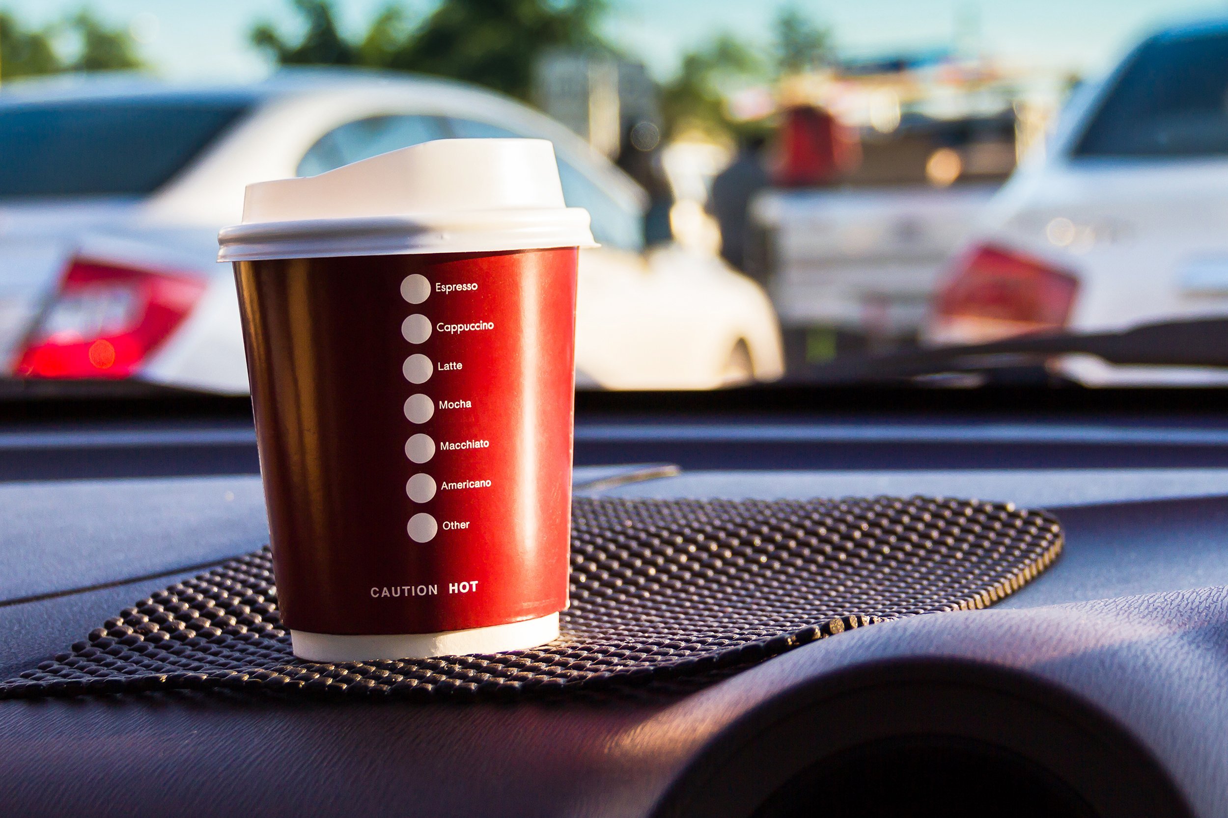 plastic coffee cup placed in the car morning