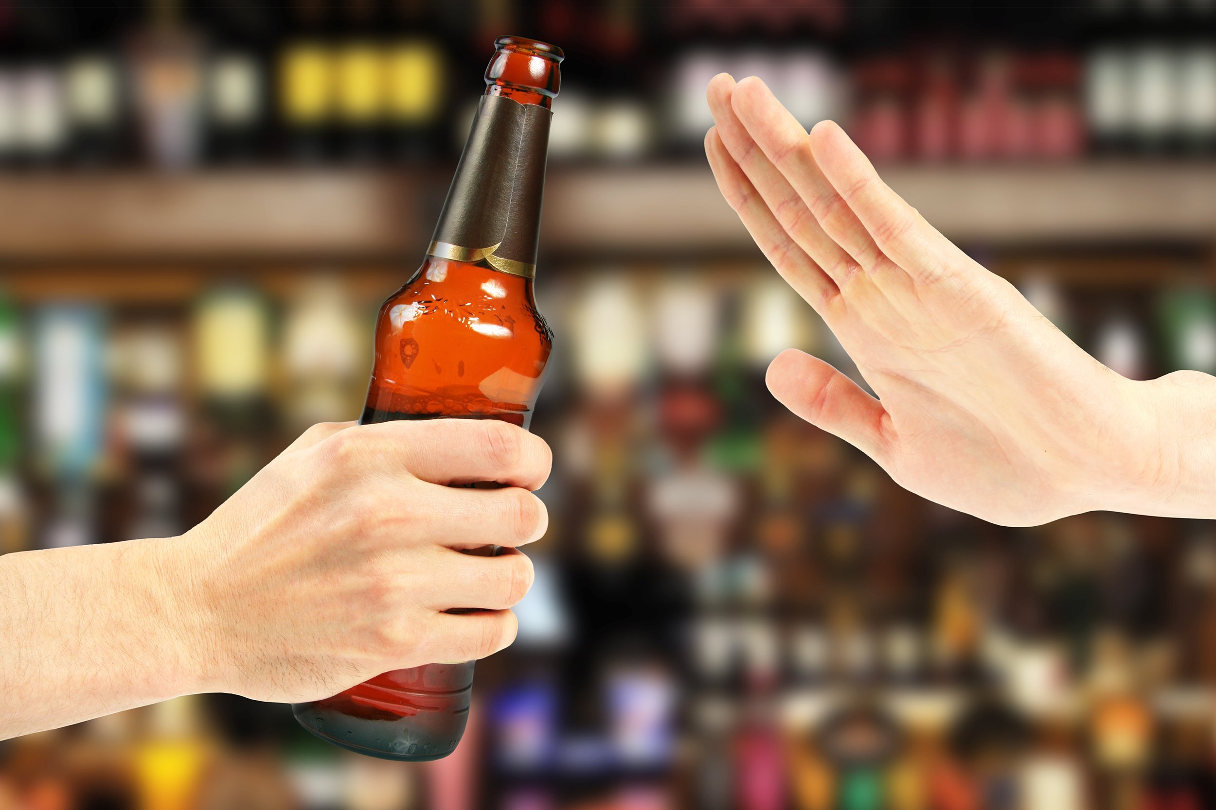 hand reject a bottle of beer in the bar