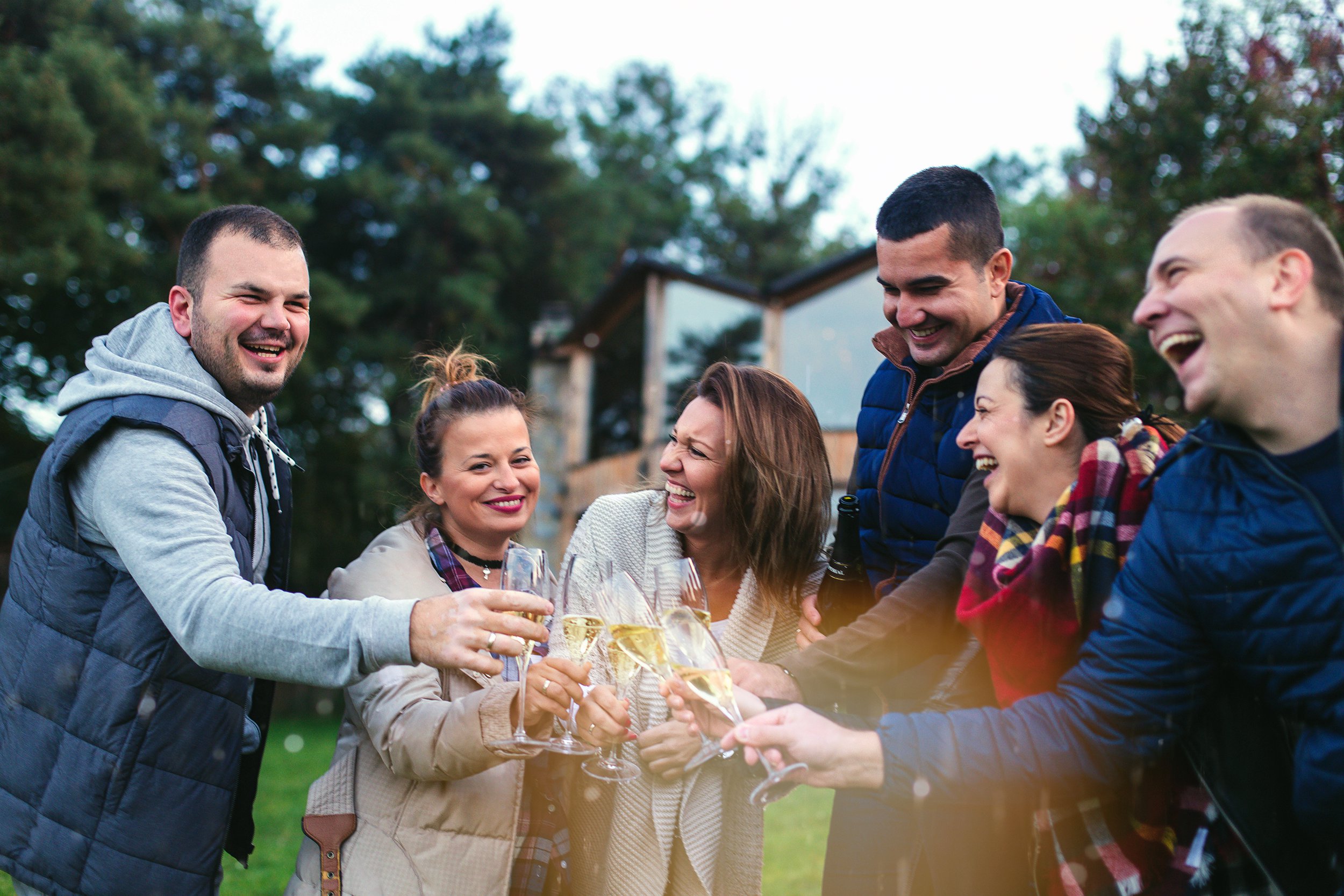 Friends having a party and celebrating with champagne
