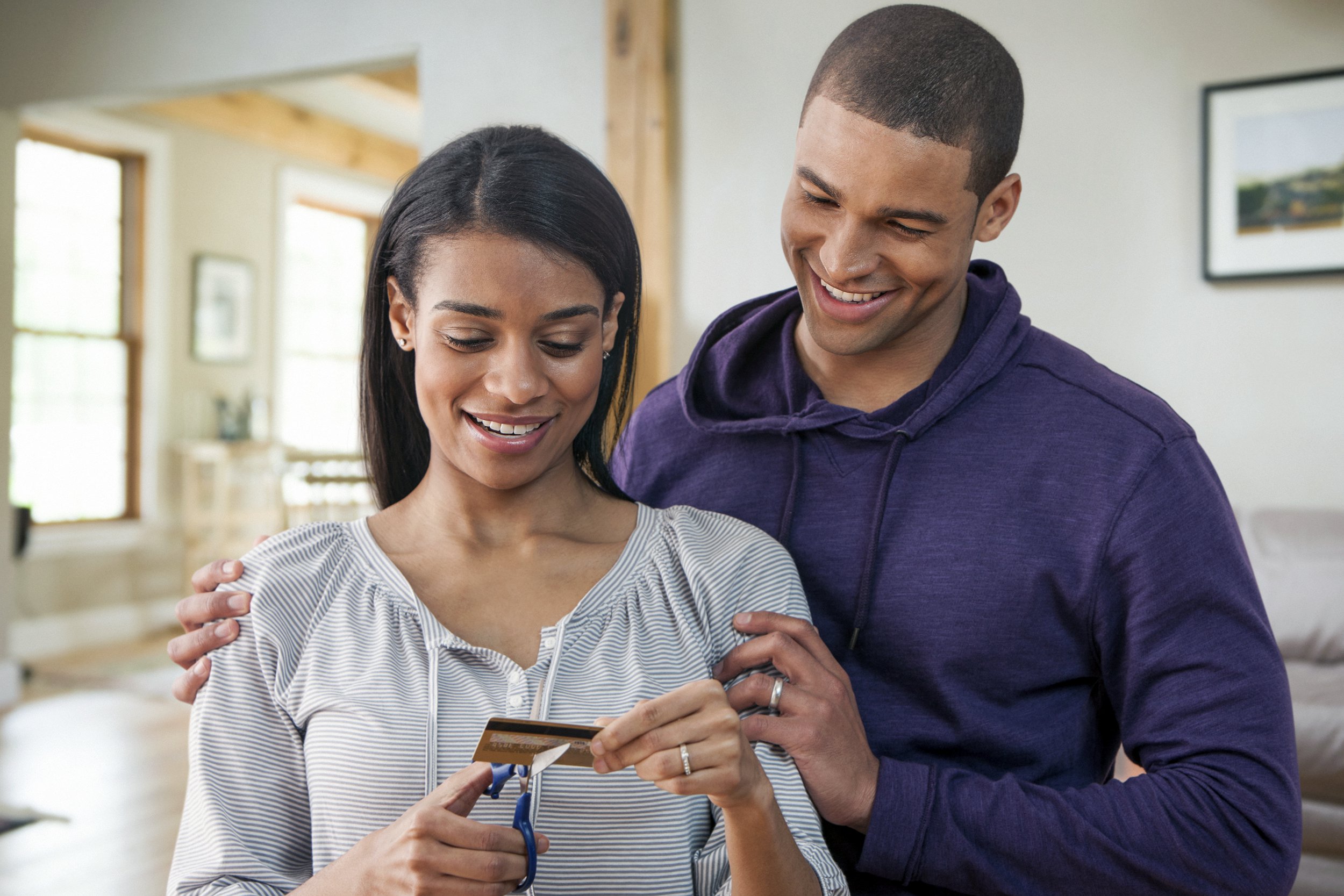 Couple cutting their credit card