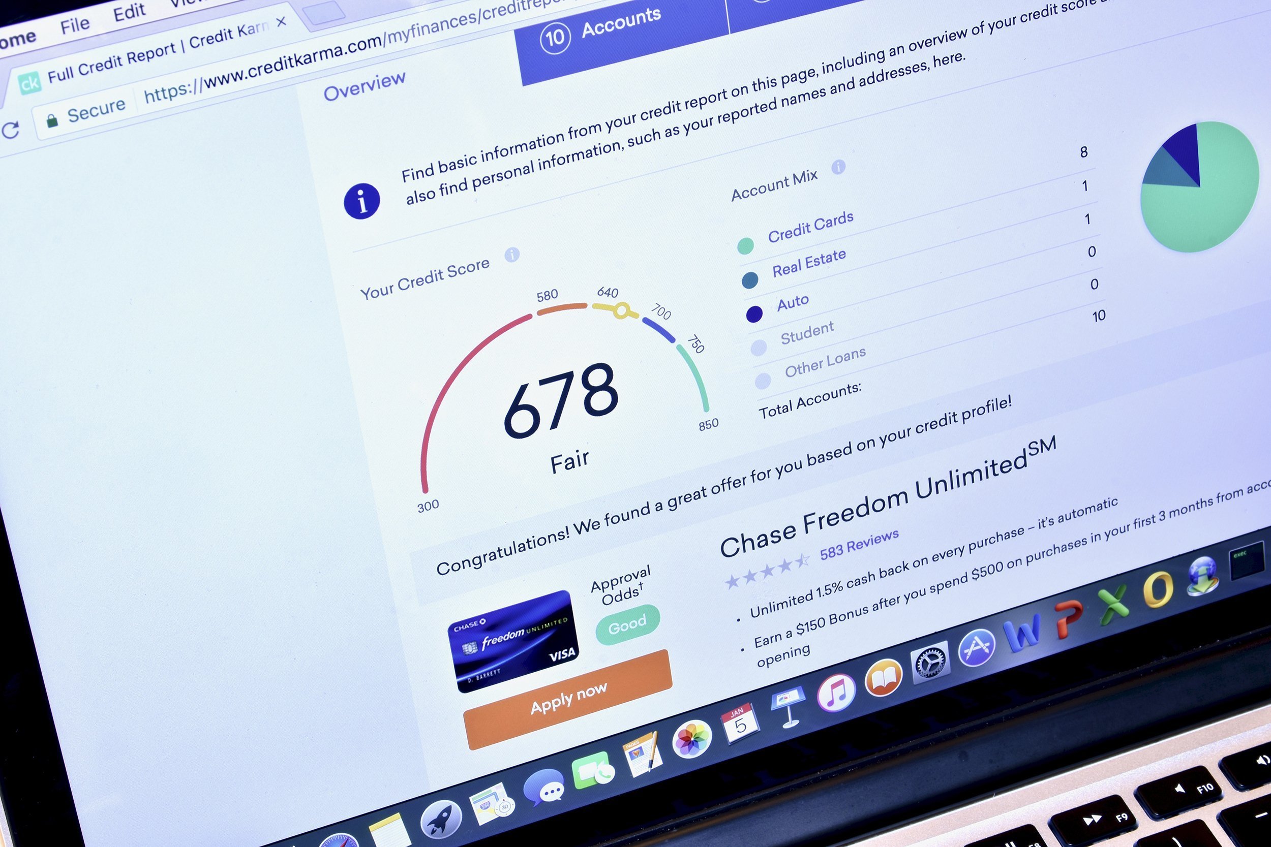 Macbook displaying the Credit Karma webpage with relevant credit score information