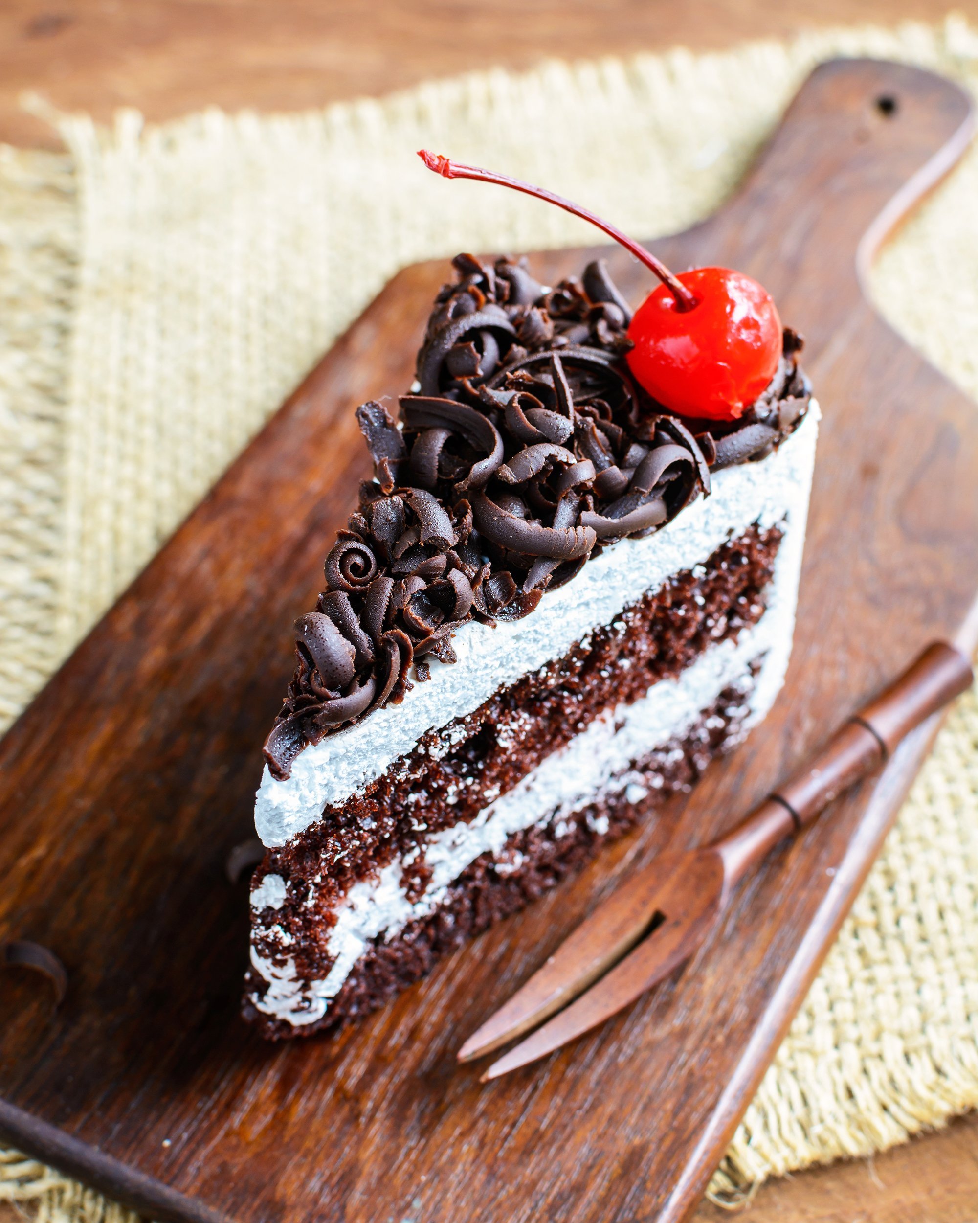 black forest cake on wooden table