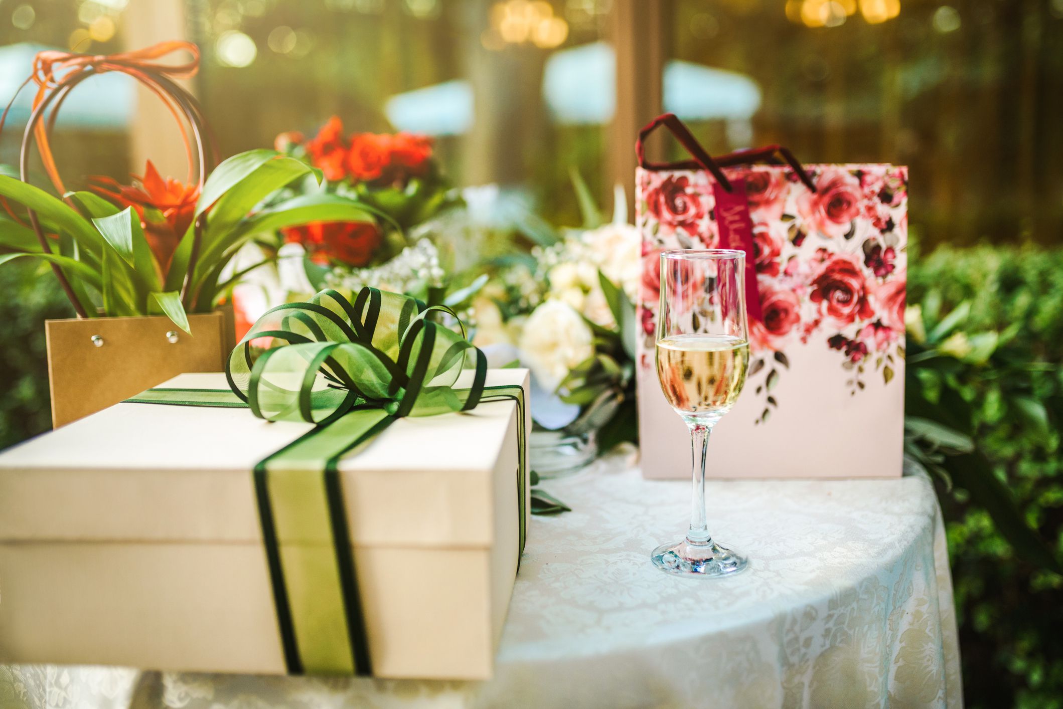 gifts at wedding and a glass of white wine