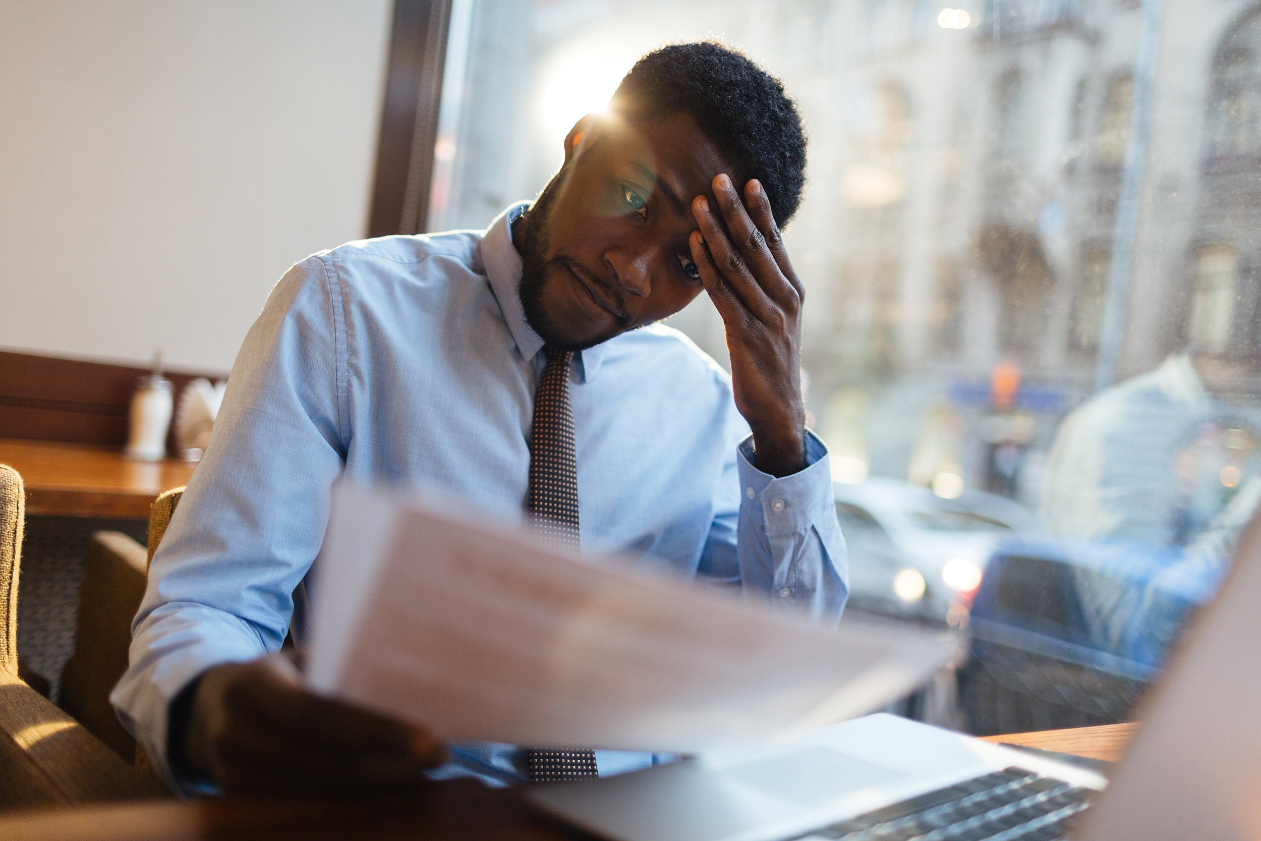stressed African American working at desk