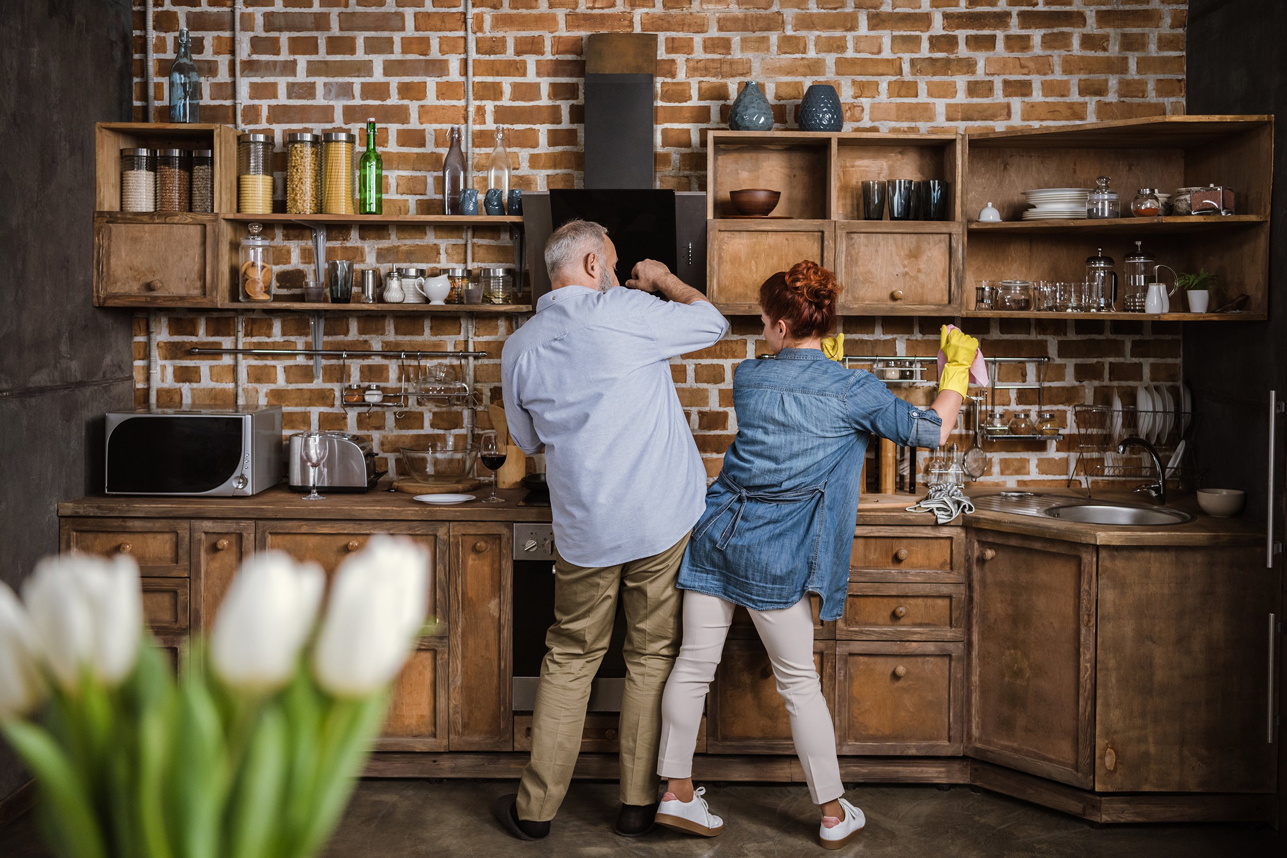 senior couple dancing in kitchen