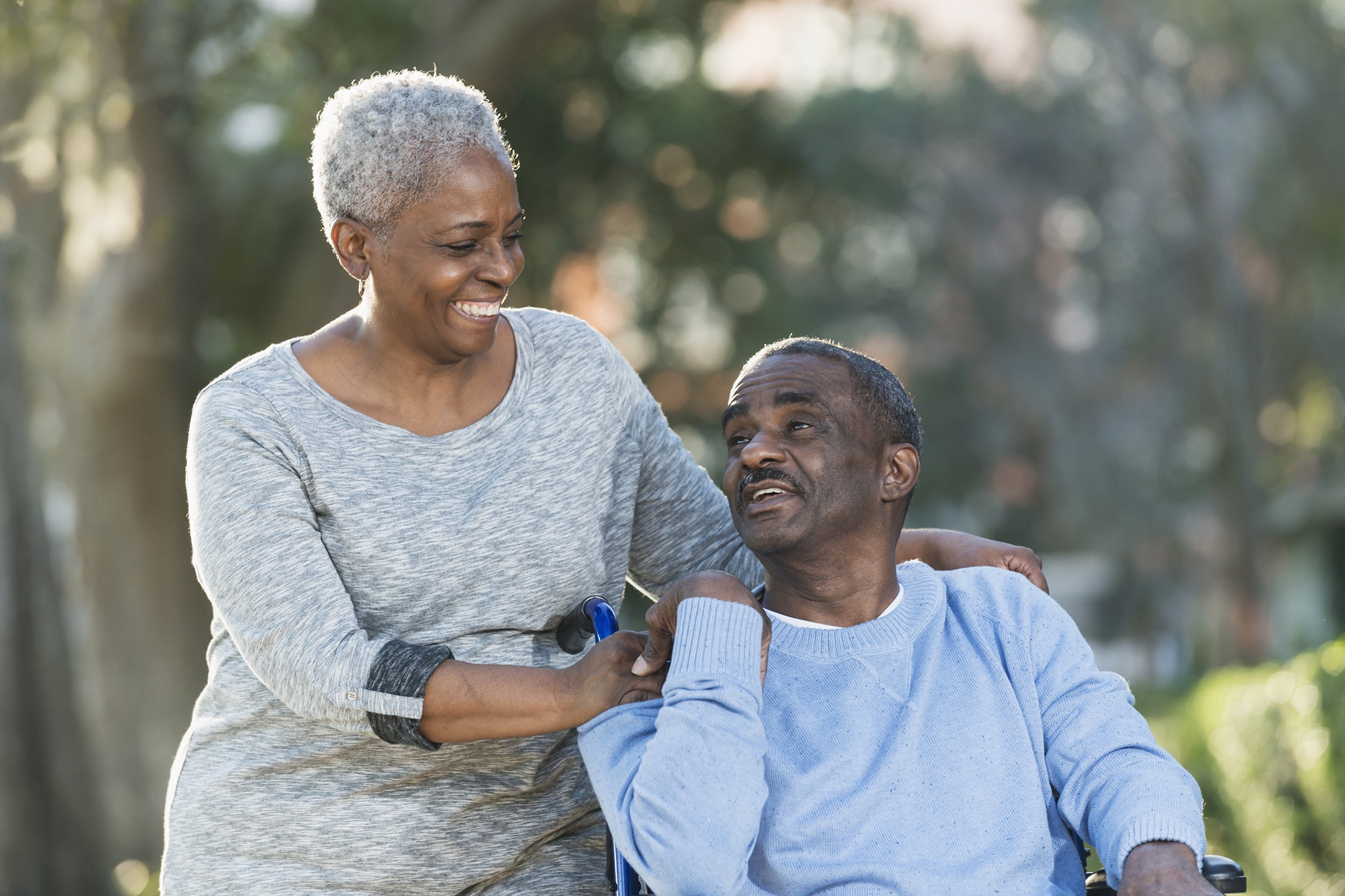 African American senior couple with man in wheelchair