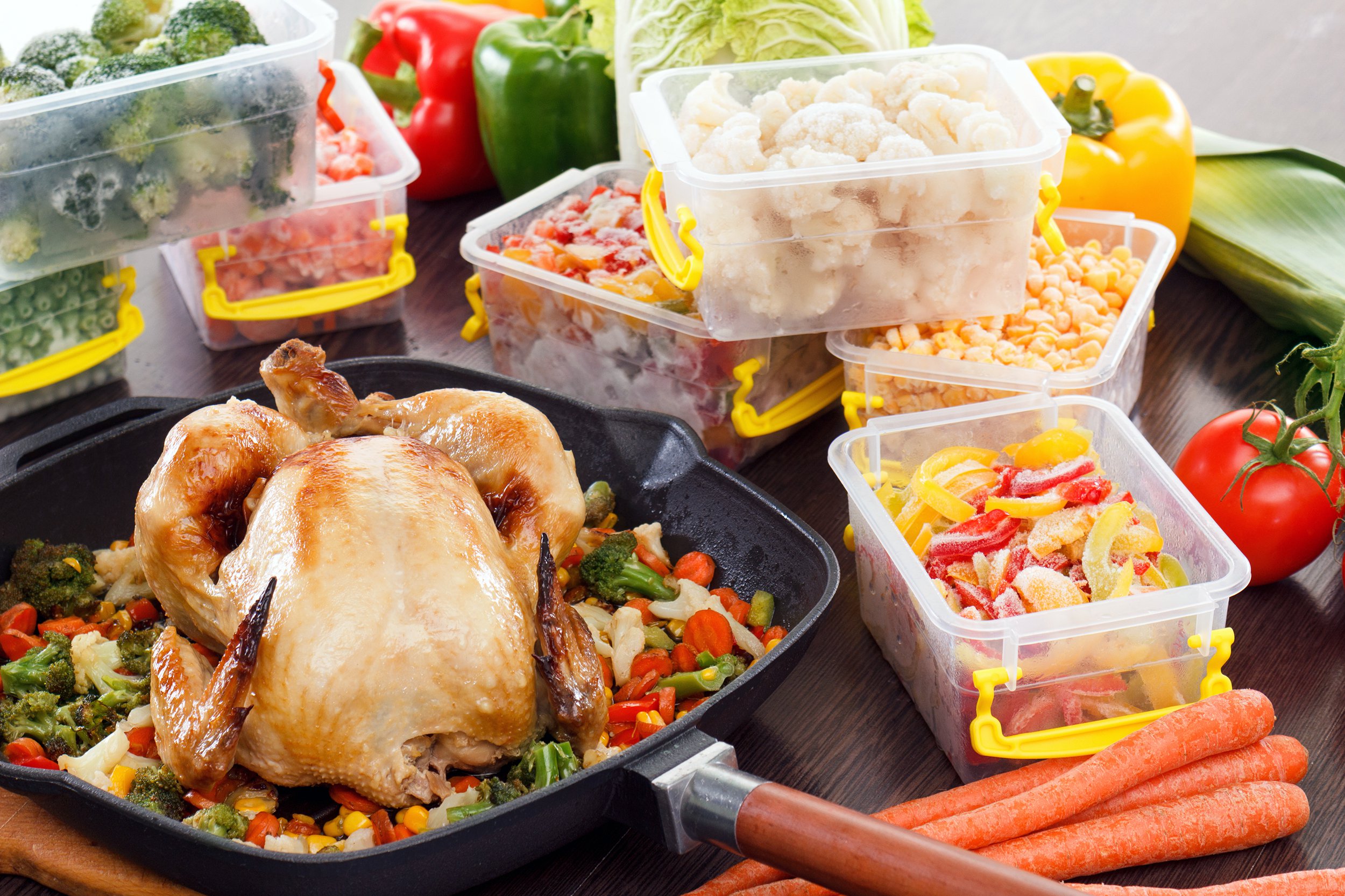 Whole roasted chicken and variety of vegetables prepped for the week