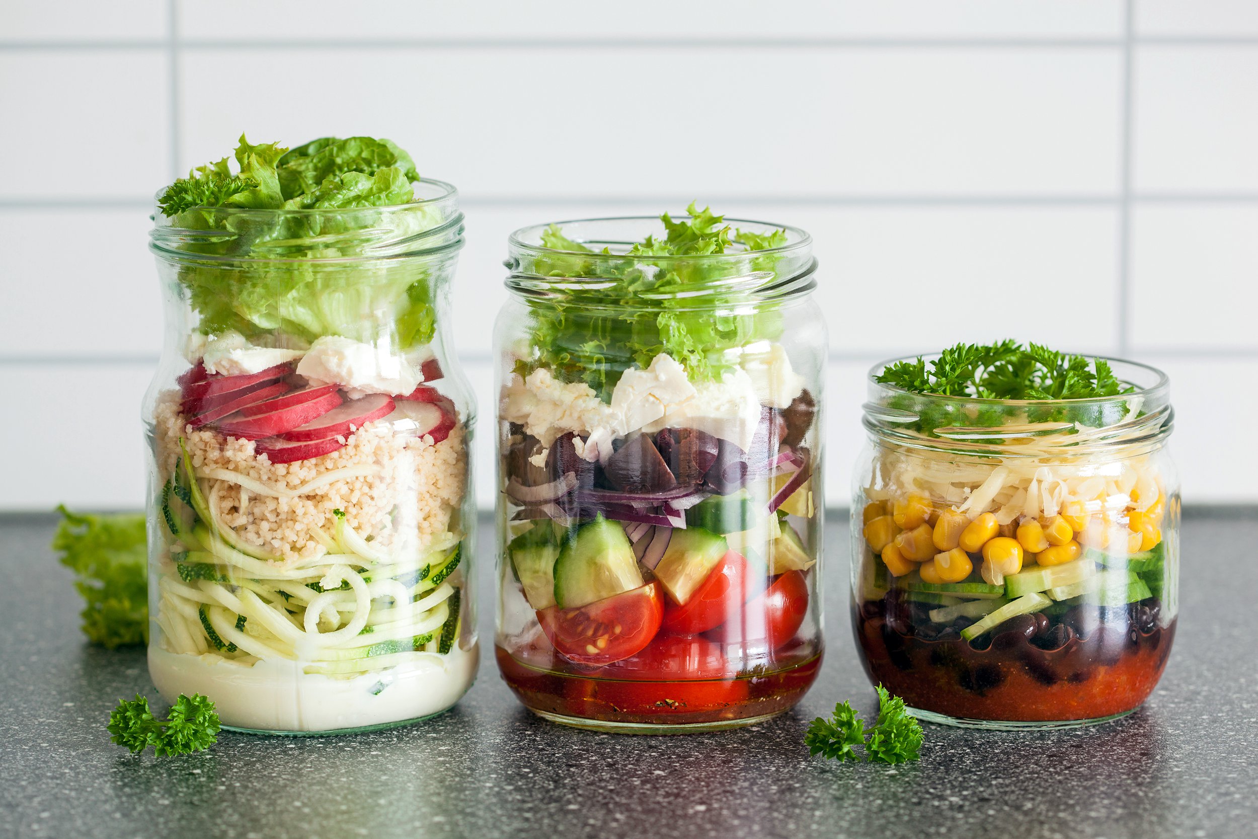Healthy salads prepared in mason jars
