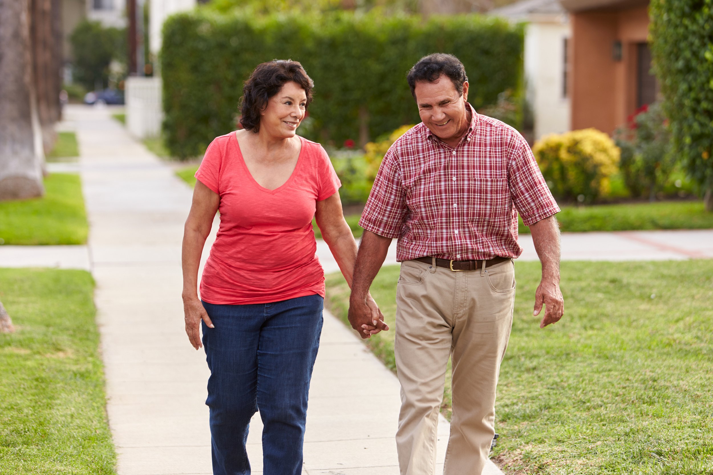Older couple walking in their neighborhood