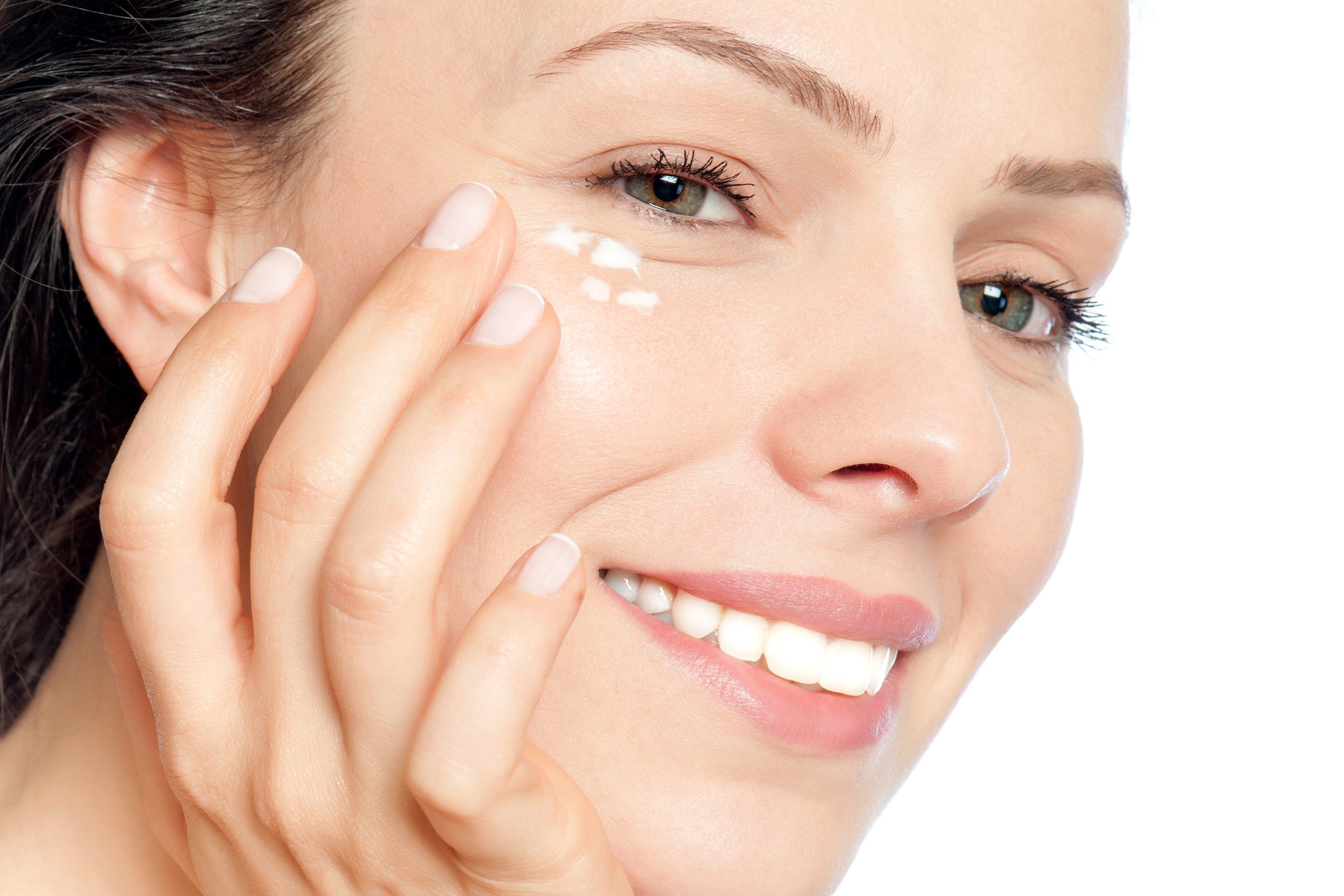 Woman applying eye cream