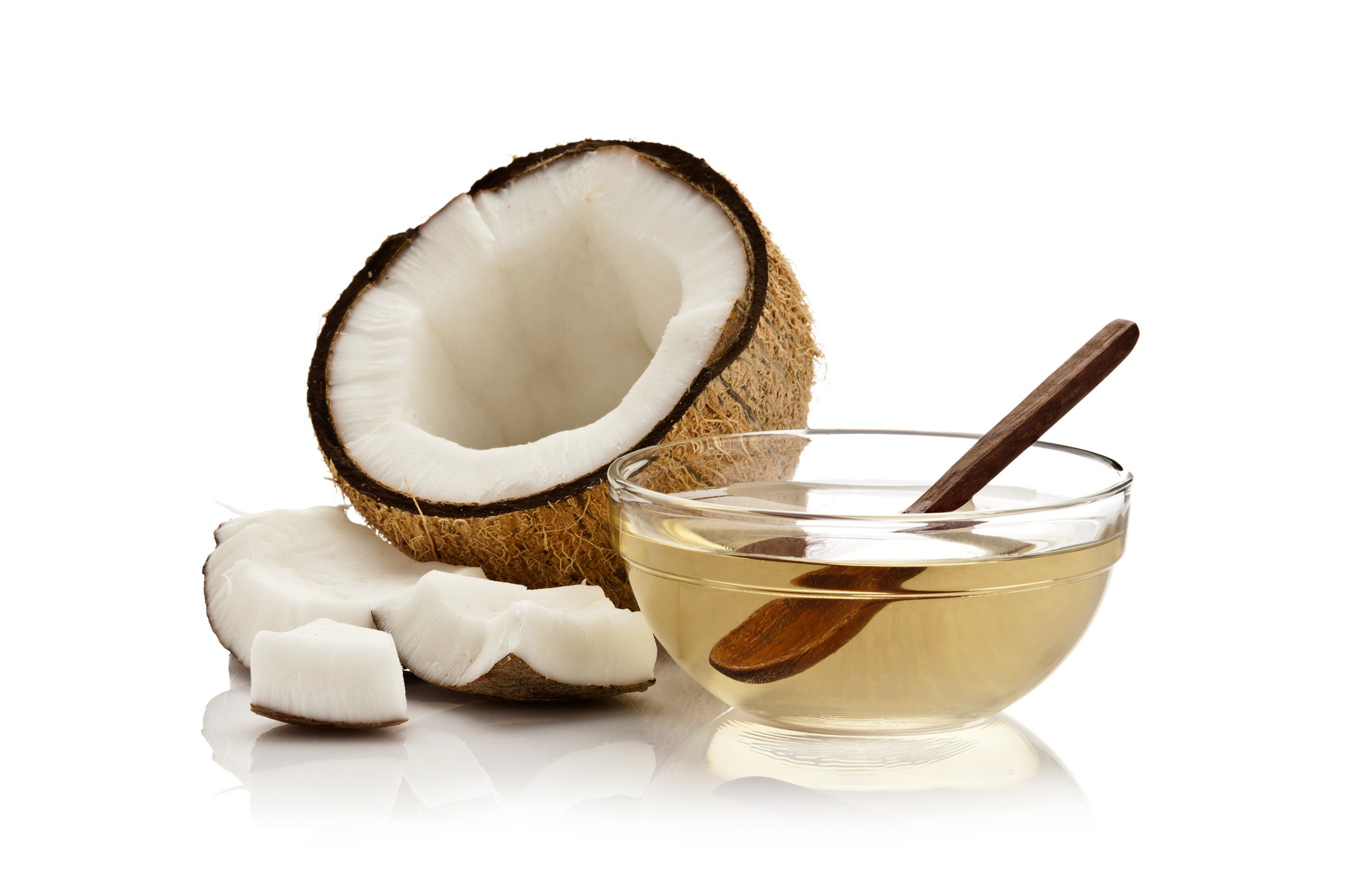 Coconut oil next to fresh cut coconut