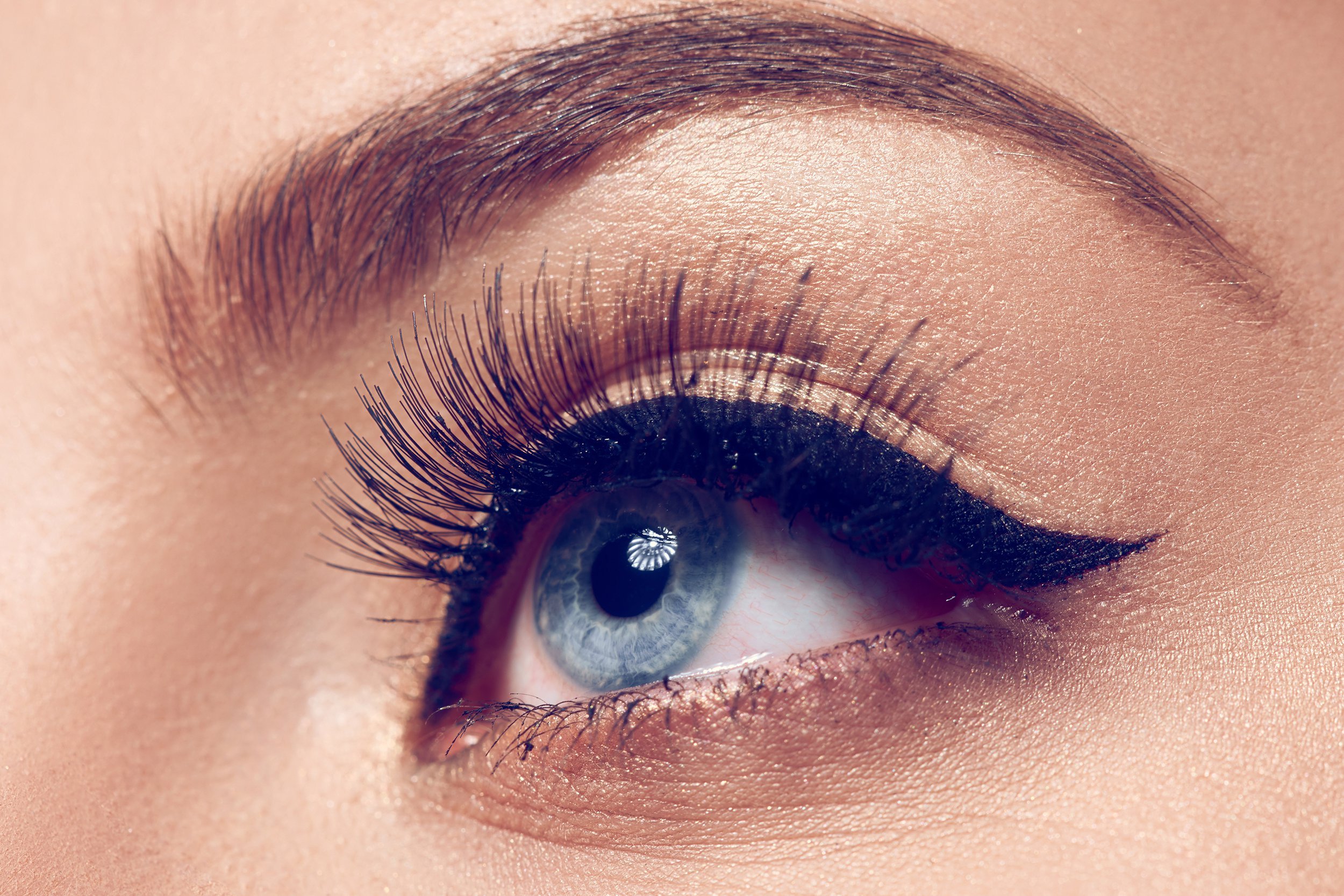 Closeup of woman's eye with cat eye makeup