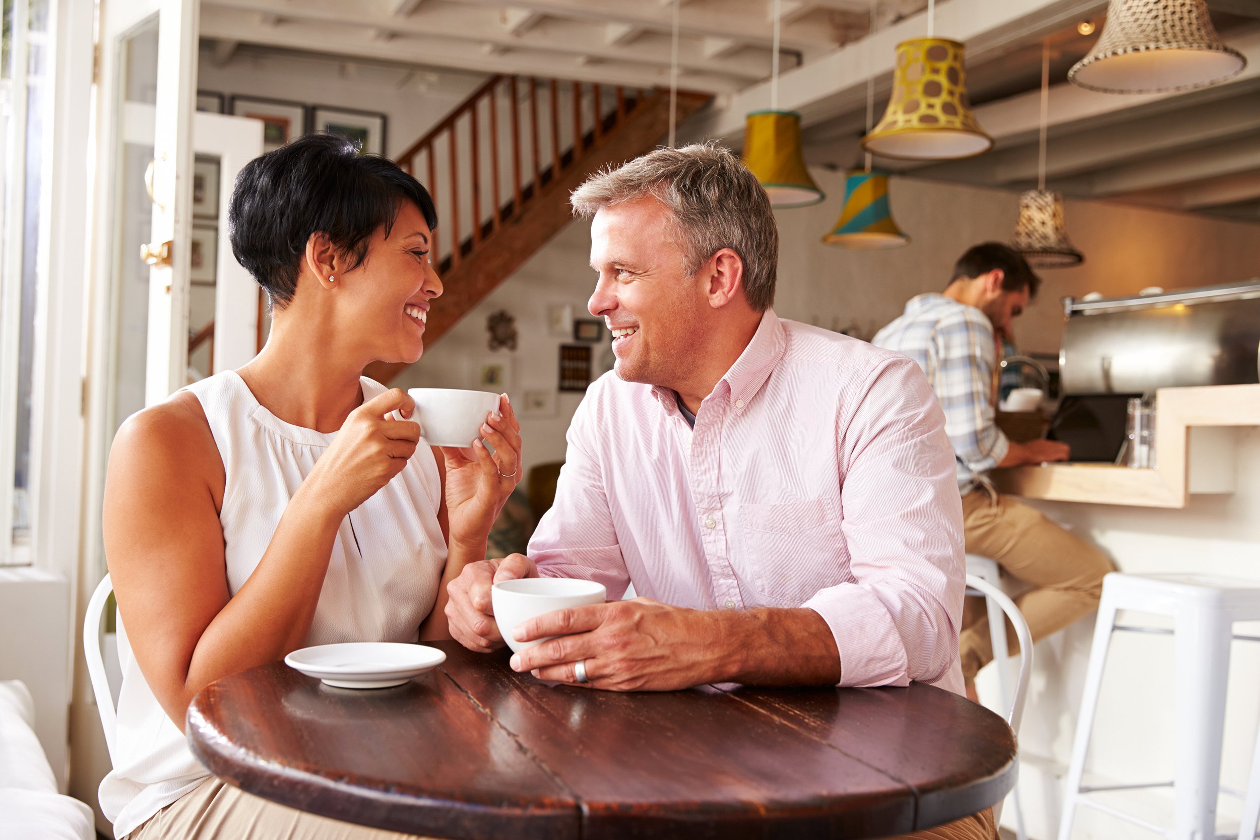 Middle-aged couple meeting for a coffee date