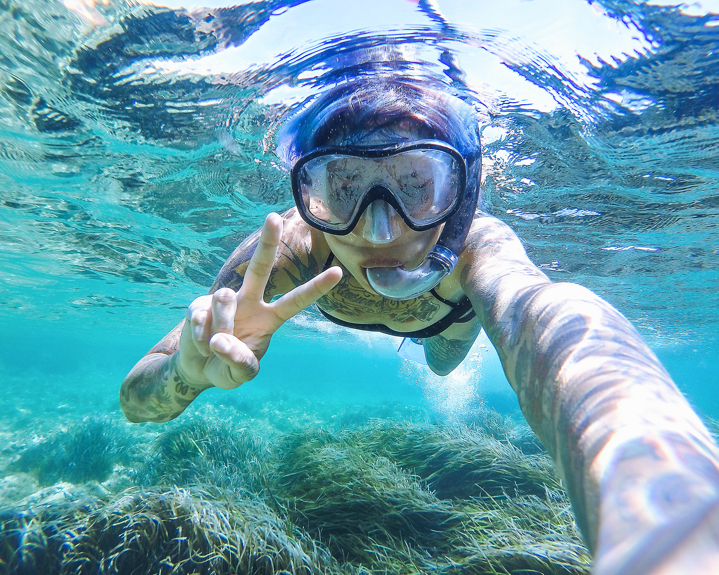 Taking a selfie underwater while scuba diving