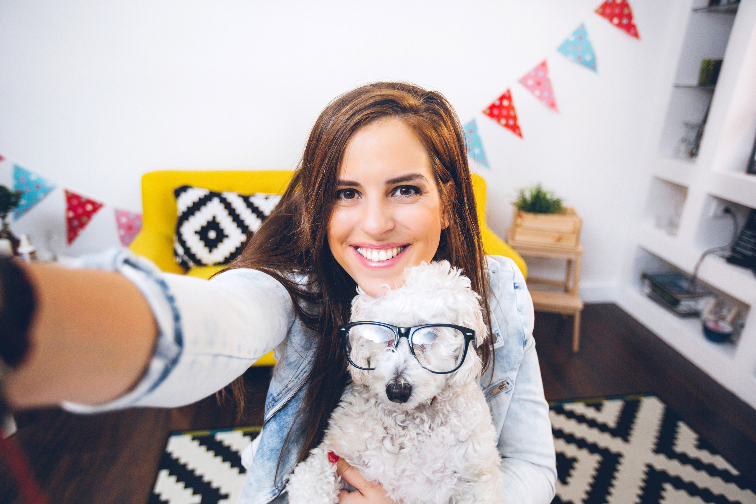 Woman taking selfie with her dog