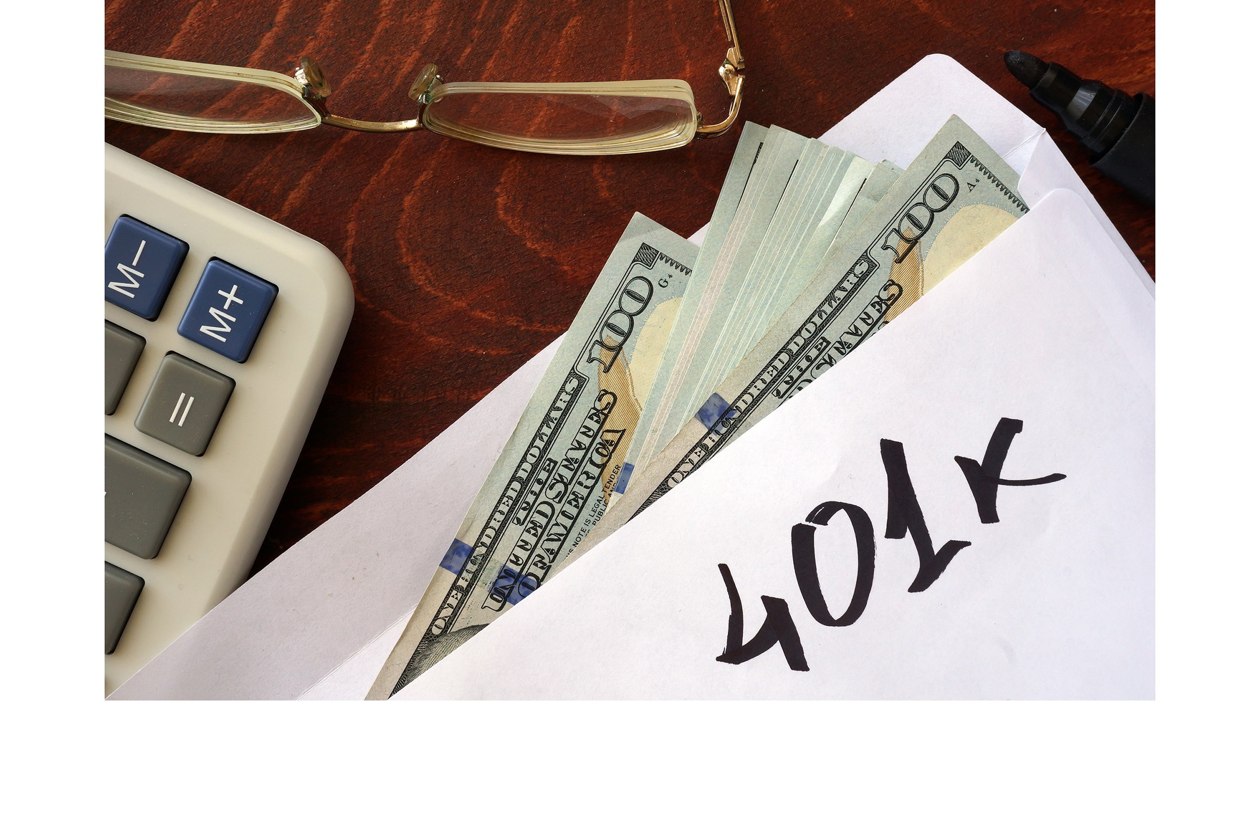 401k written on envelope with money