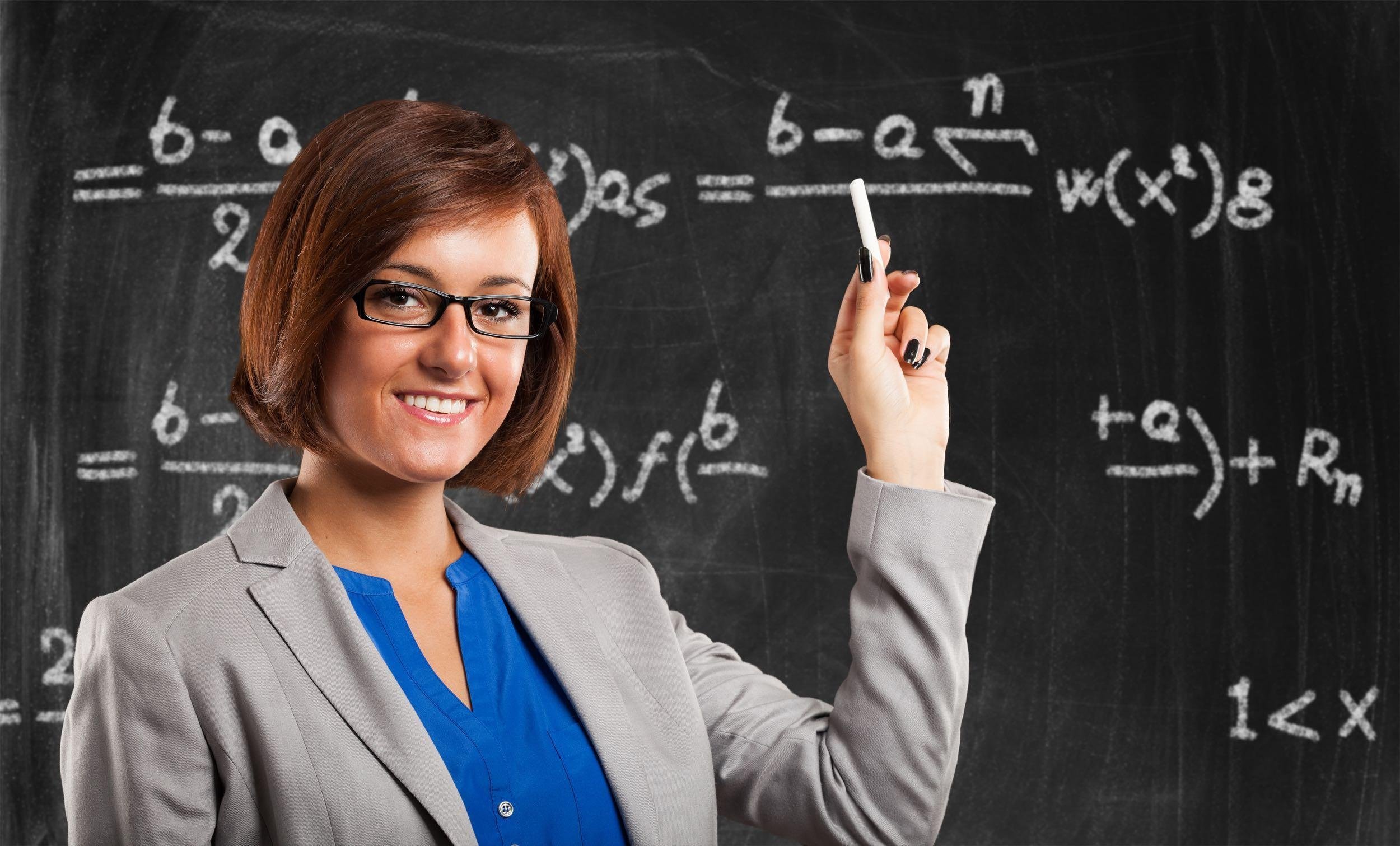 female teacher and blackboard